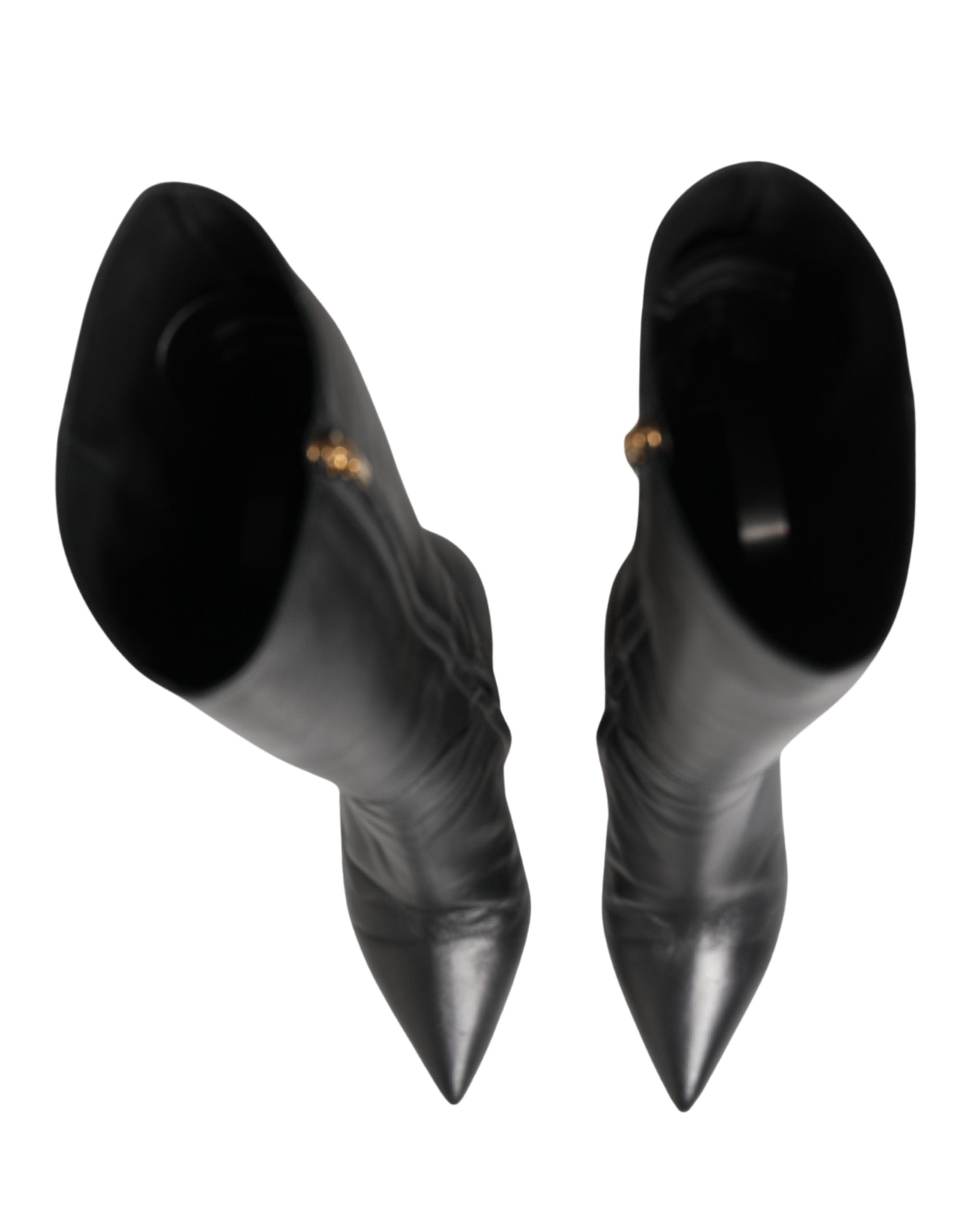 Experience the allure of Dolce & Gabbana's black leather knee-high boots, a testament to Italian craftsmanship that elevates your elegance and confidence.