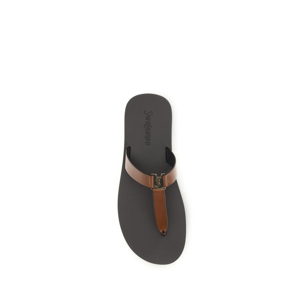 Indulge in the exquisite Saint Laurent Brown Calf Leather Bos Taurus Flip-Flop Sandals, where unparalleled craftsmanship meets effortless elegance for a sophisticated summer.