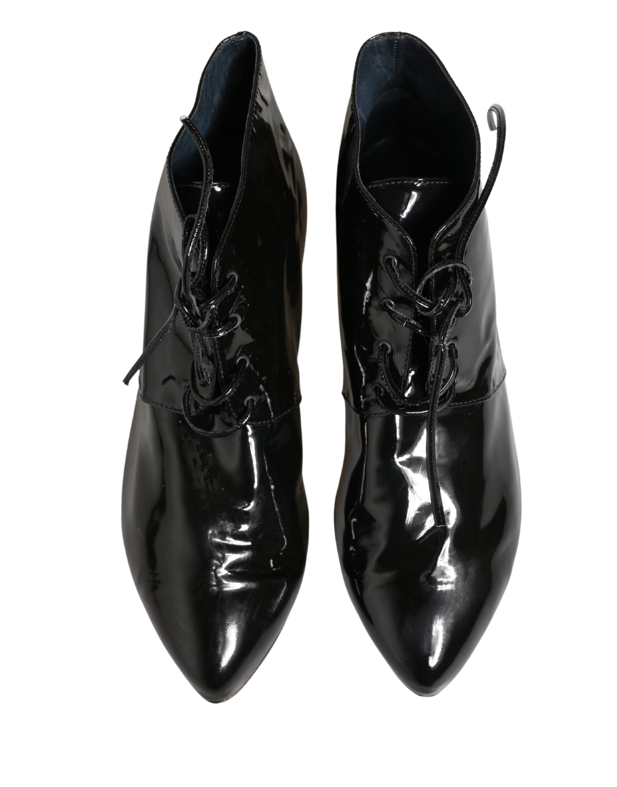 Elevate your style with Dolce & Gabbana's Black Leather Ankle Boots, a masterpiece of Italian craftsmanship that embodies sophistication and allure for any occasion.