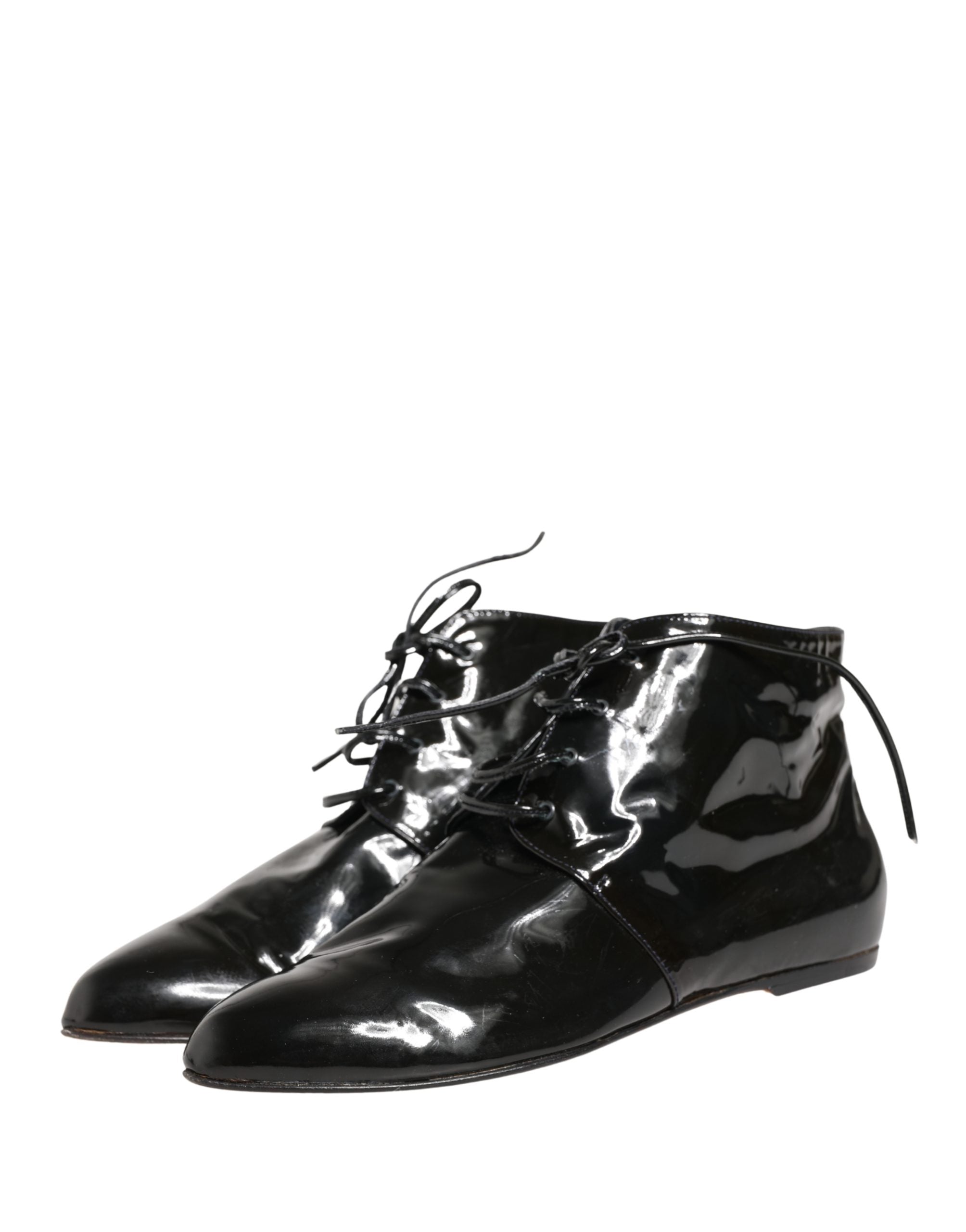 Elevate your style with Dolce & Gabbana's Black Leather Ankle Boots, a masterpiece of Italian craftsmanship that embodies sophistication and timeless allure.