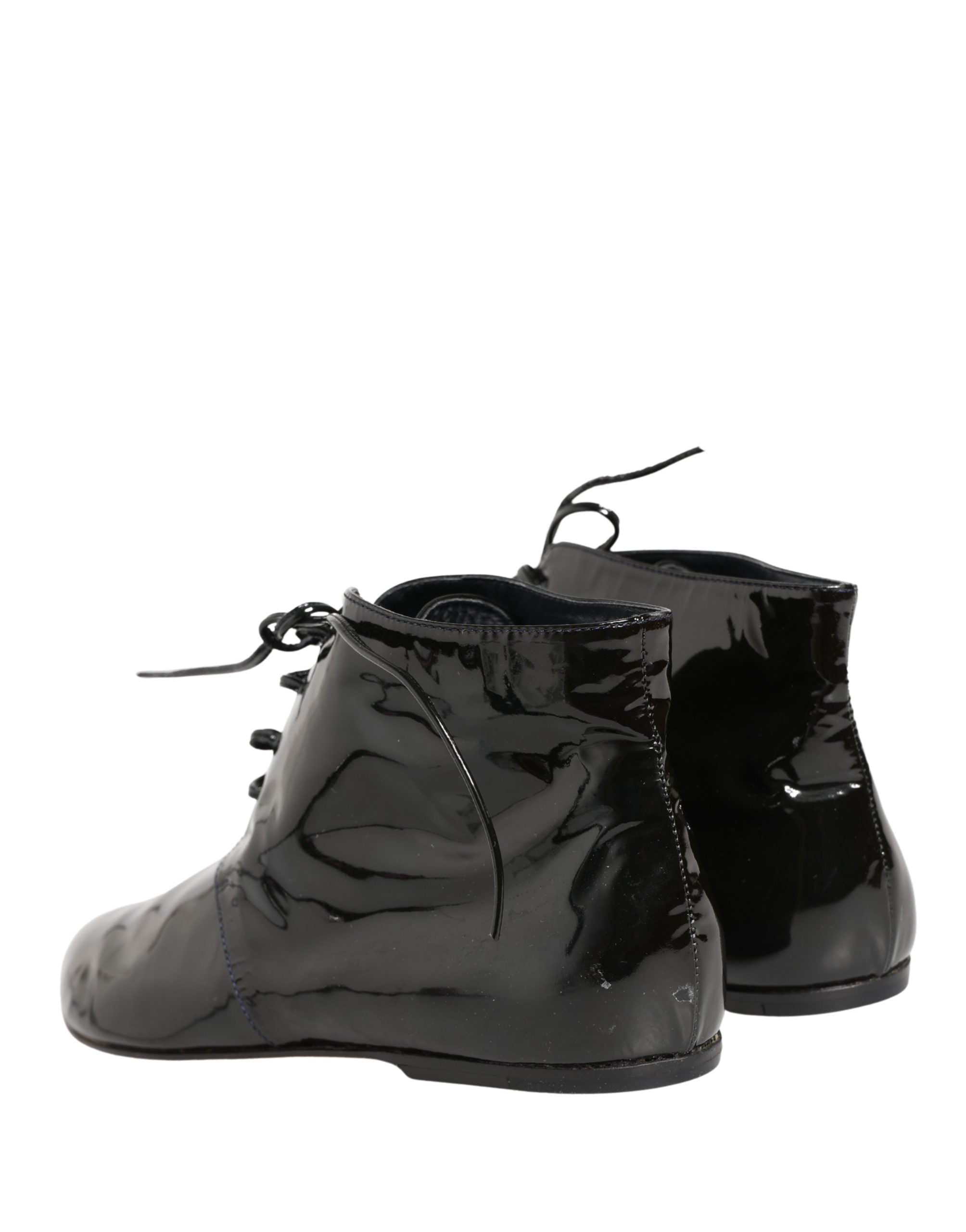 Elevate your style with Dolce & Gabbana's Black Leather Ankle Boots, a fusion of Italian craftsmanship and timeless elegance, perfect for the discerning fashion connoisseur.