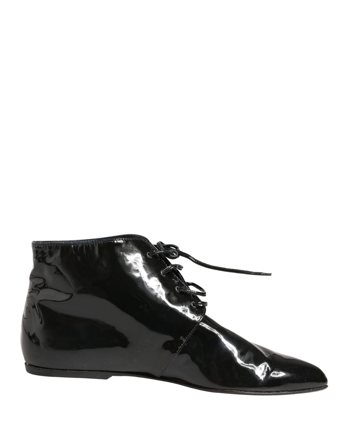 Step into the realm of luxury with Dolce & Gabbana's Black Leather Ankle Boots, where exquisite Italian craftsmanship meets timeless elegance for the discerning individual.