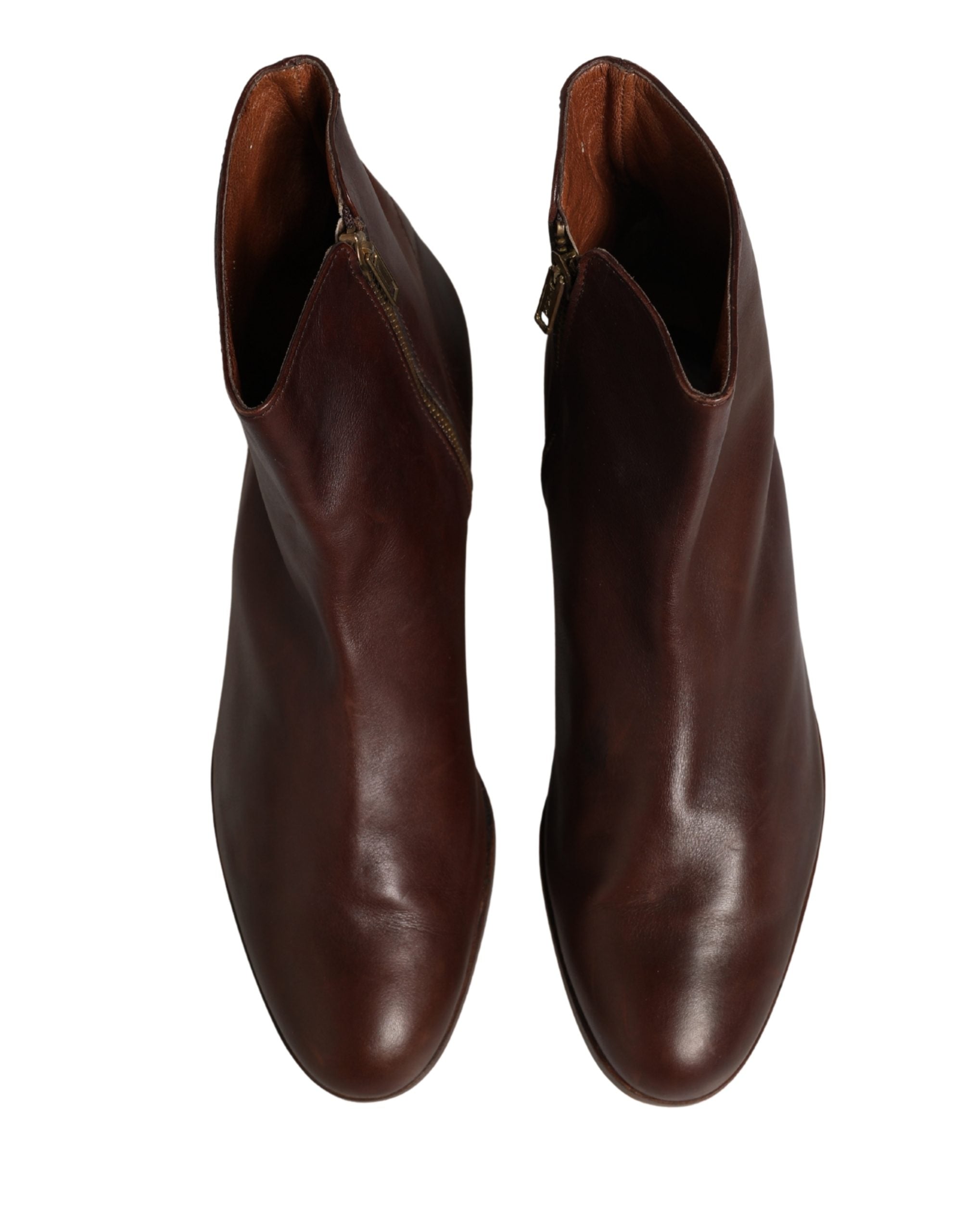 Experience the exquisite craftsmanship of Dolce & Gabbana's brown leather ankle boots, where timeless elegance meets contemporary allure, perfect for any sophisticated wardrobe.