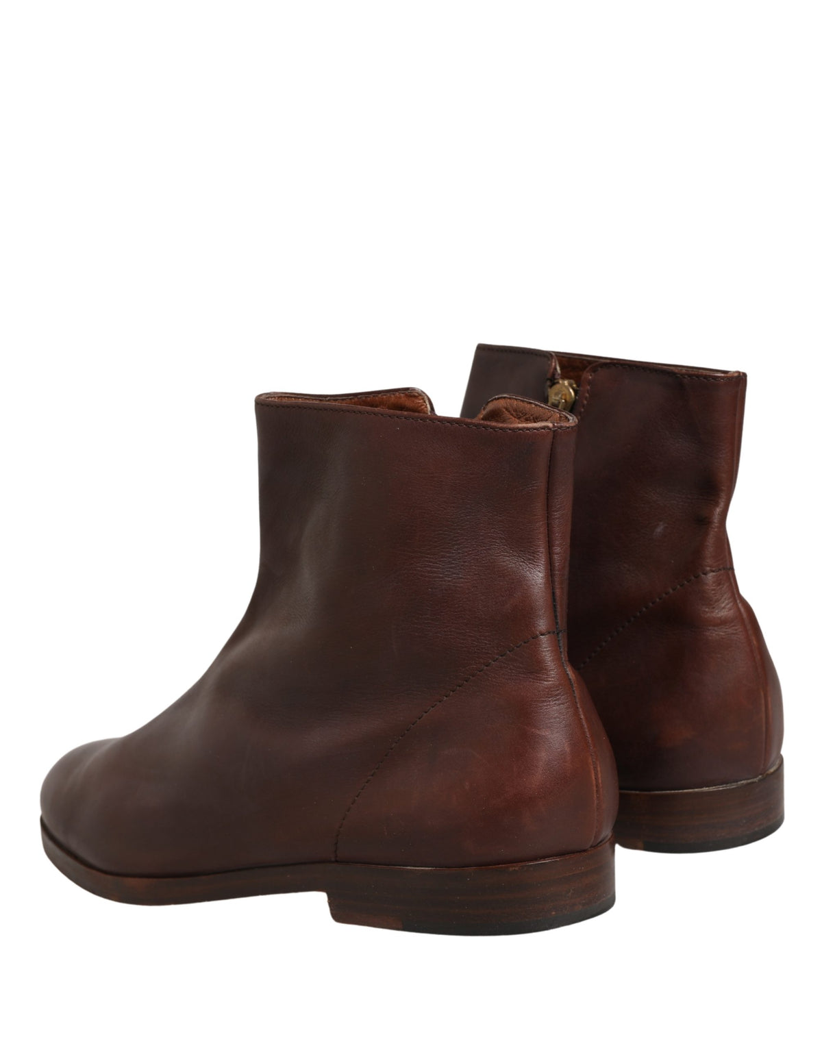 Step into a realm of elegance with Dolce & Gabbana's brown leather ankle boots, where exquisite craftsmanship meets timeless style, perfect for any sophisticated wardrobe.