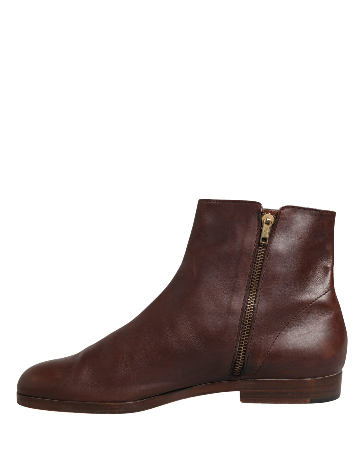 Experience the exquisite craftsmanship of Dolce & Gabbana's brown leather ankle boots, a perfect fusion of elegance and versatility for the discerning fashion connoisseur.