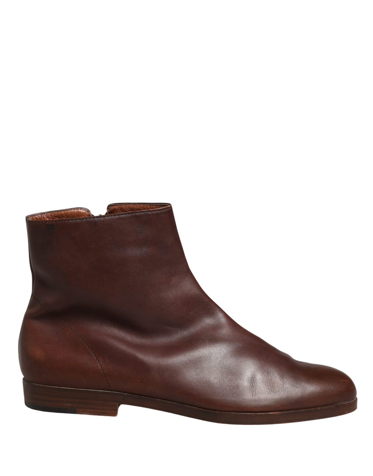 Experience the exquisite craftsmanship of Dolce & Gabbana's brown leather ankle boots, where Italian artistry meets timeless elegance for the discerning connoisseur.