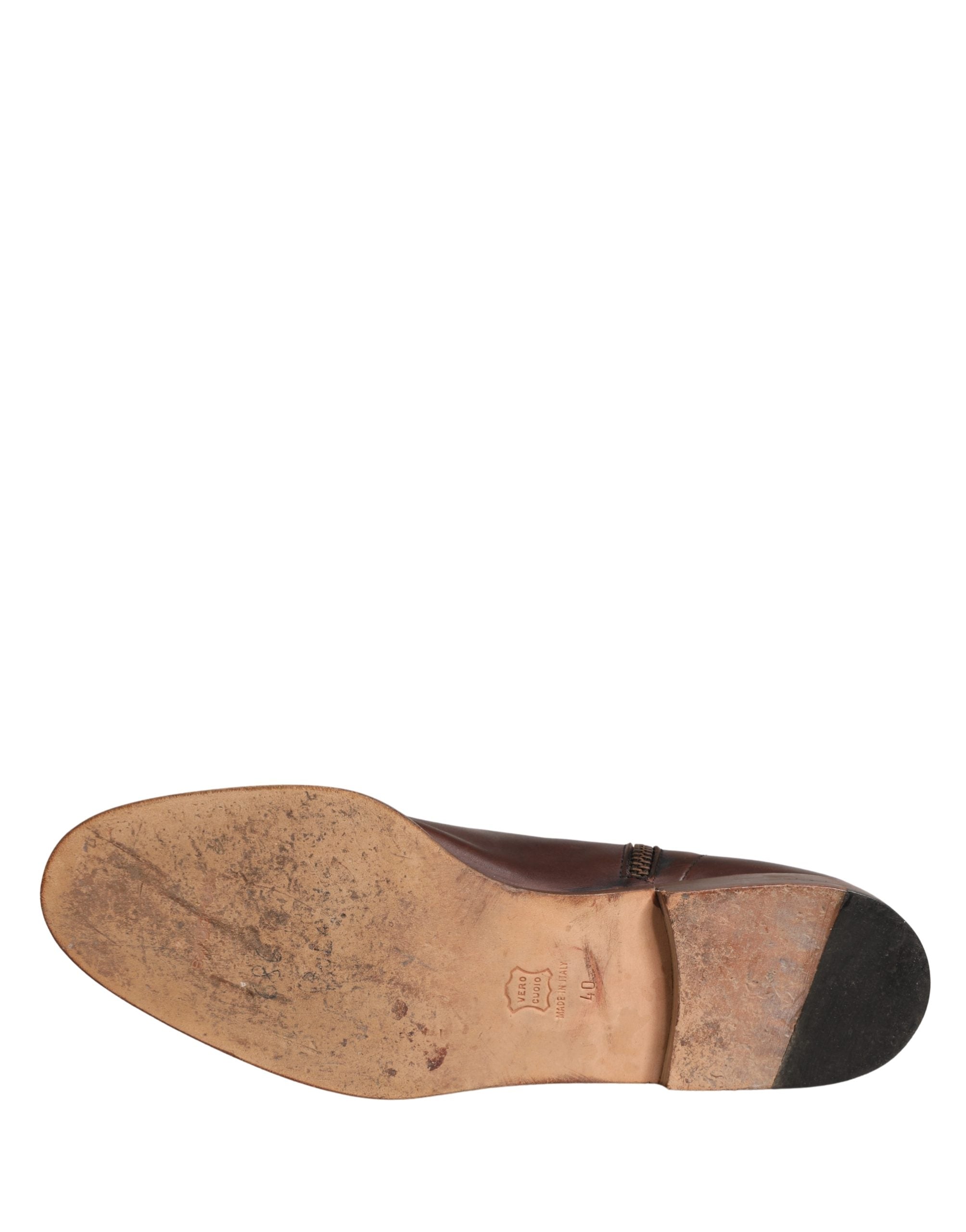 Experience the exquisite craftsmanship of Dolce & Gabbana's brown leather ankle boots, a luxurious blend of elegance and versatility for the discerning individual.
