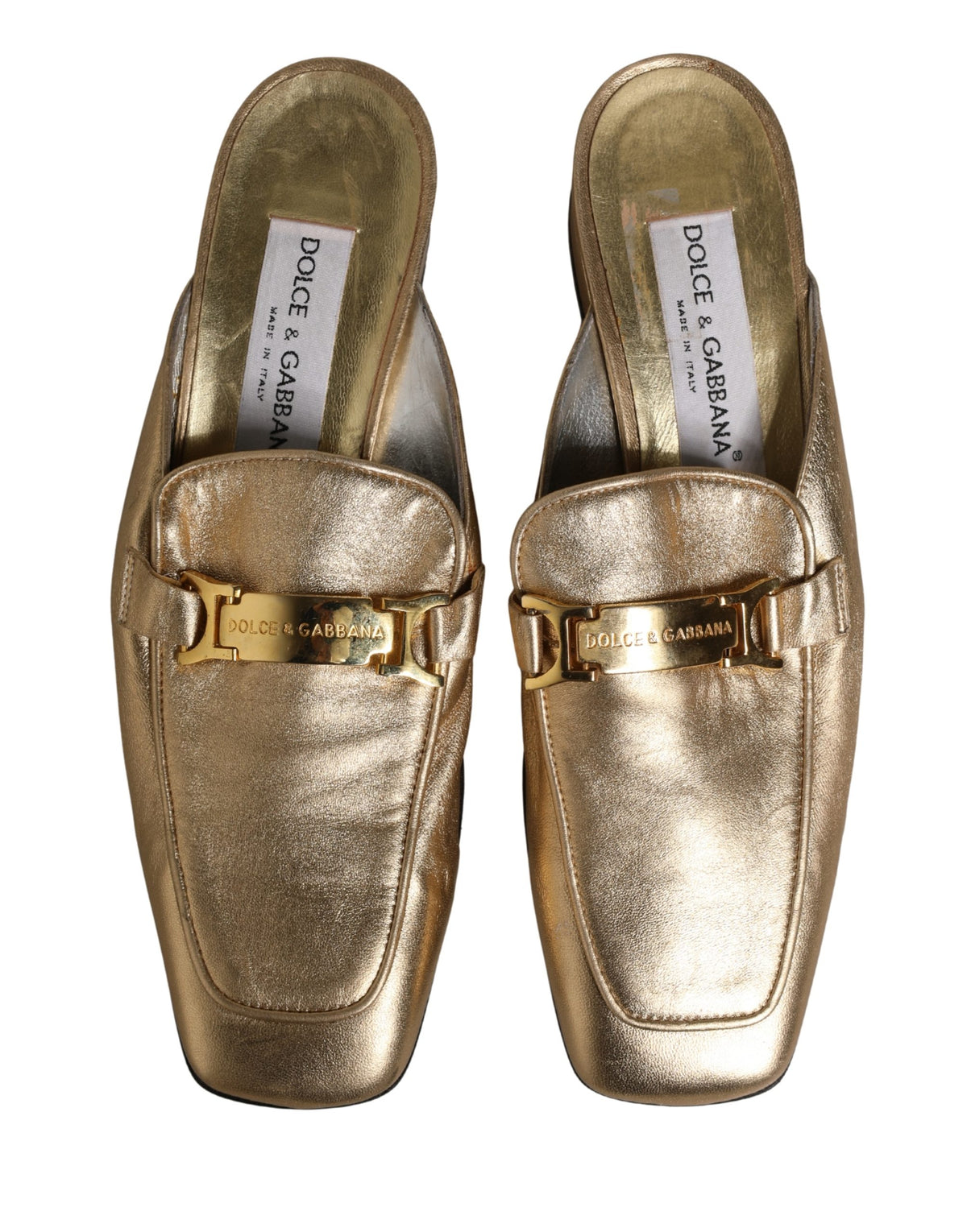 Indulge in the opulence of Dolce & Gabbana's Gold Leather Flats, where exquisite craftsmanship meets timeless elegance, perfect for elevating any sophisticated ensemble.