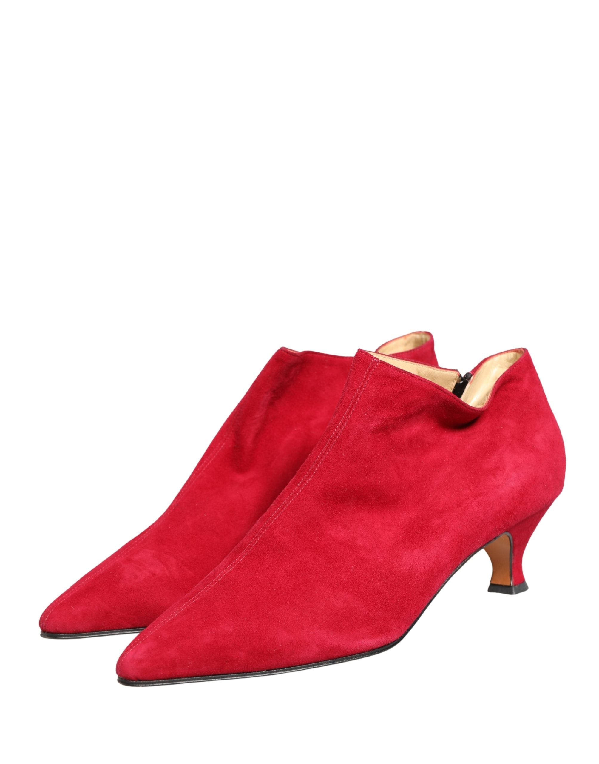 Step into a realm of opulence with Dolce & Gabbana's Red Suede Ankle Boots, where exquisite Italian craftsmanship meets timeless elegance, perfect for any sophisticated occasion.