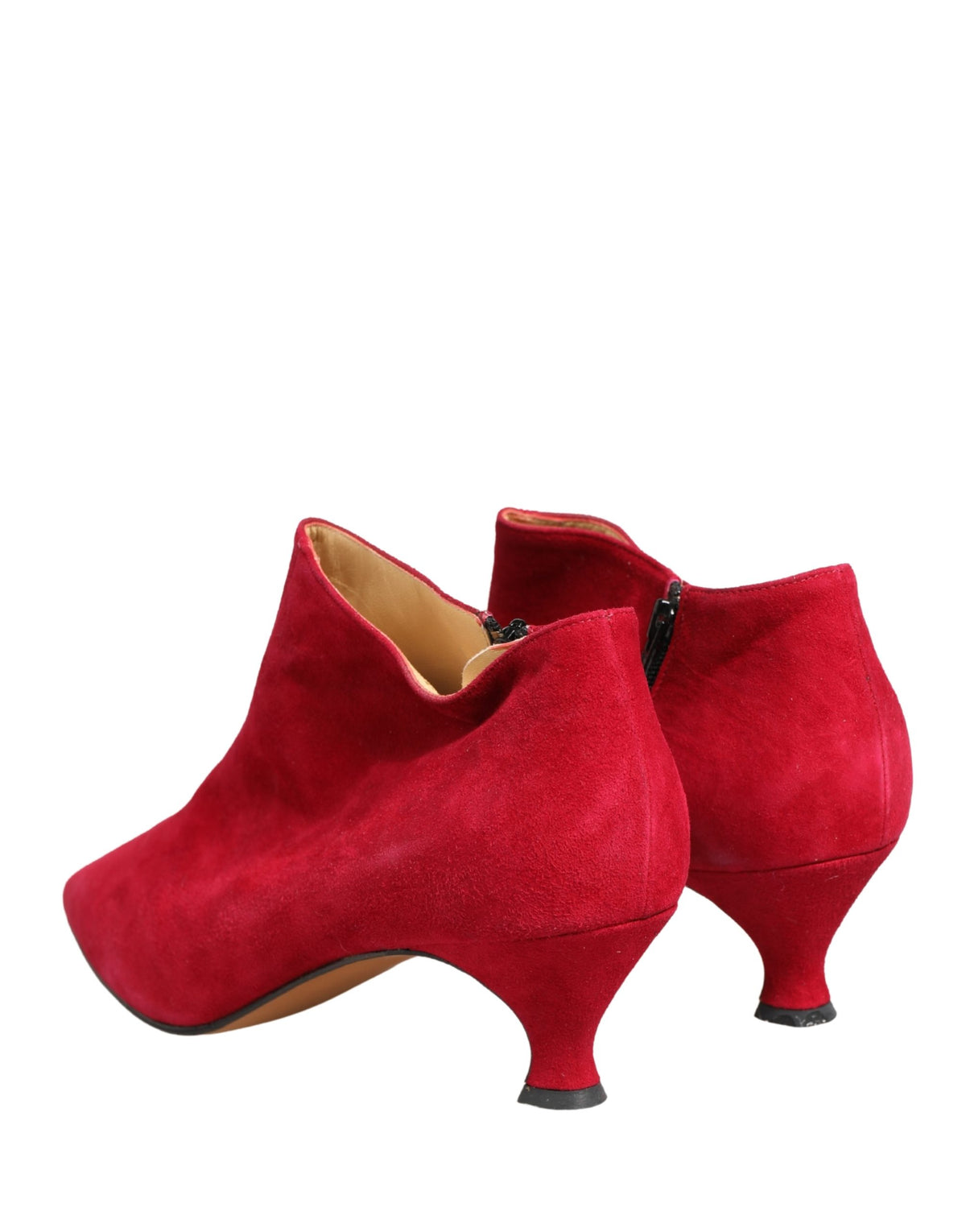 Elevate your style with Dolce & Gabbana's Red Suede Ankle Boots, a masterpiece of Italian craftsmanship that embodies timeless elegance and luxurious allure.