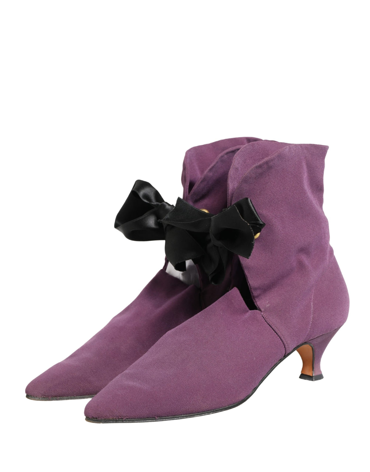 Indulge in the exquisite Dolce & Gabbana Purple Mid Calf Boots, where sumptuous suede meets Italian craftsmanship, embodying timeless elegance for the discerning individual.