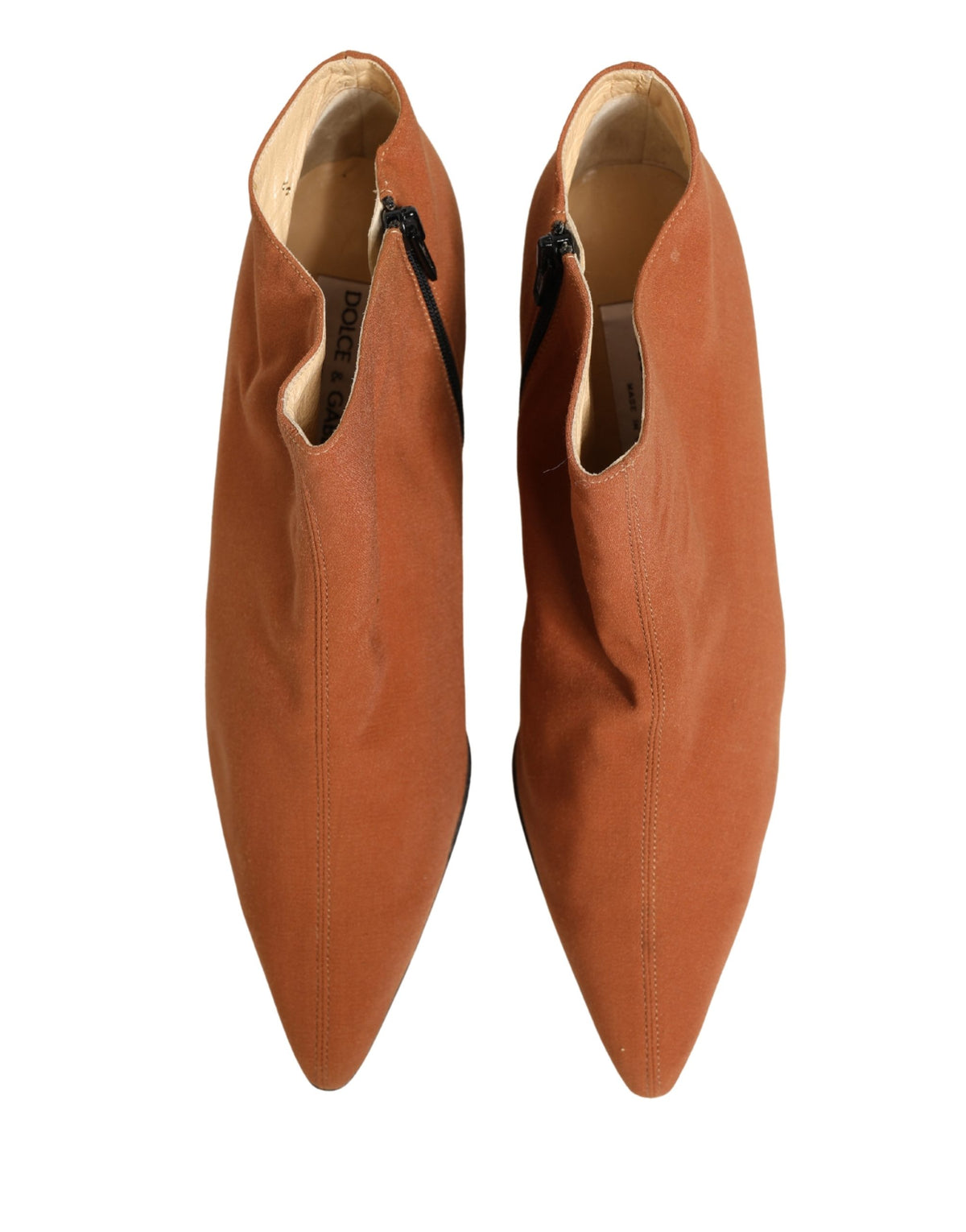 Indulge in the exquisite Dolce & Gabbana Brown Suede Ankle Boots, where Italian craftsmanship meets timeless elegance, perfect for elevating any sophisticated ensemble.