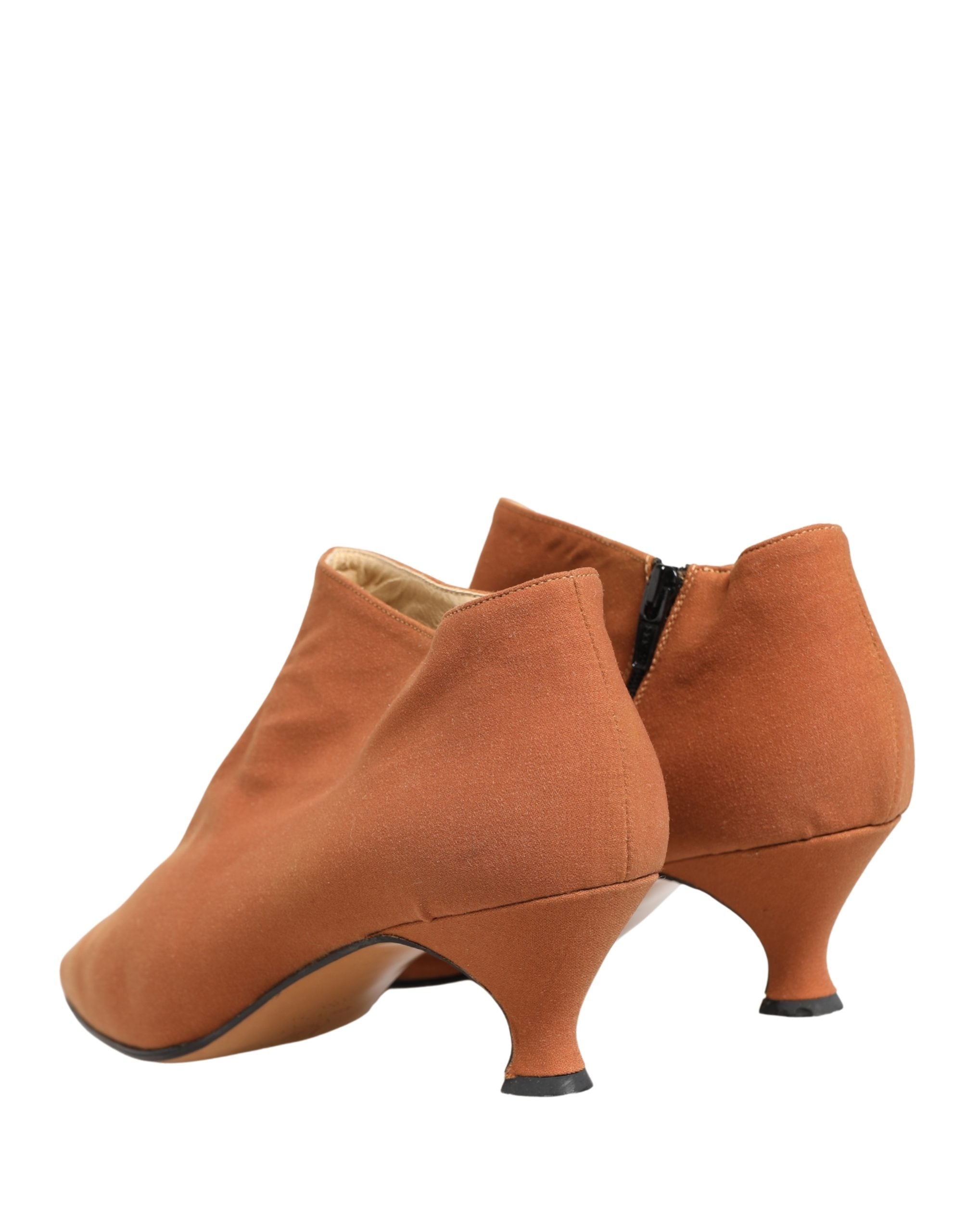 Elevate your style with Dolce & Gabbana Brown Suede Ankle Boots, a masterpiece of Italian craftsmanship that embodies timeless elegance and luxurious allure.