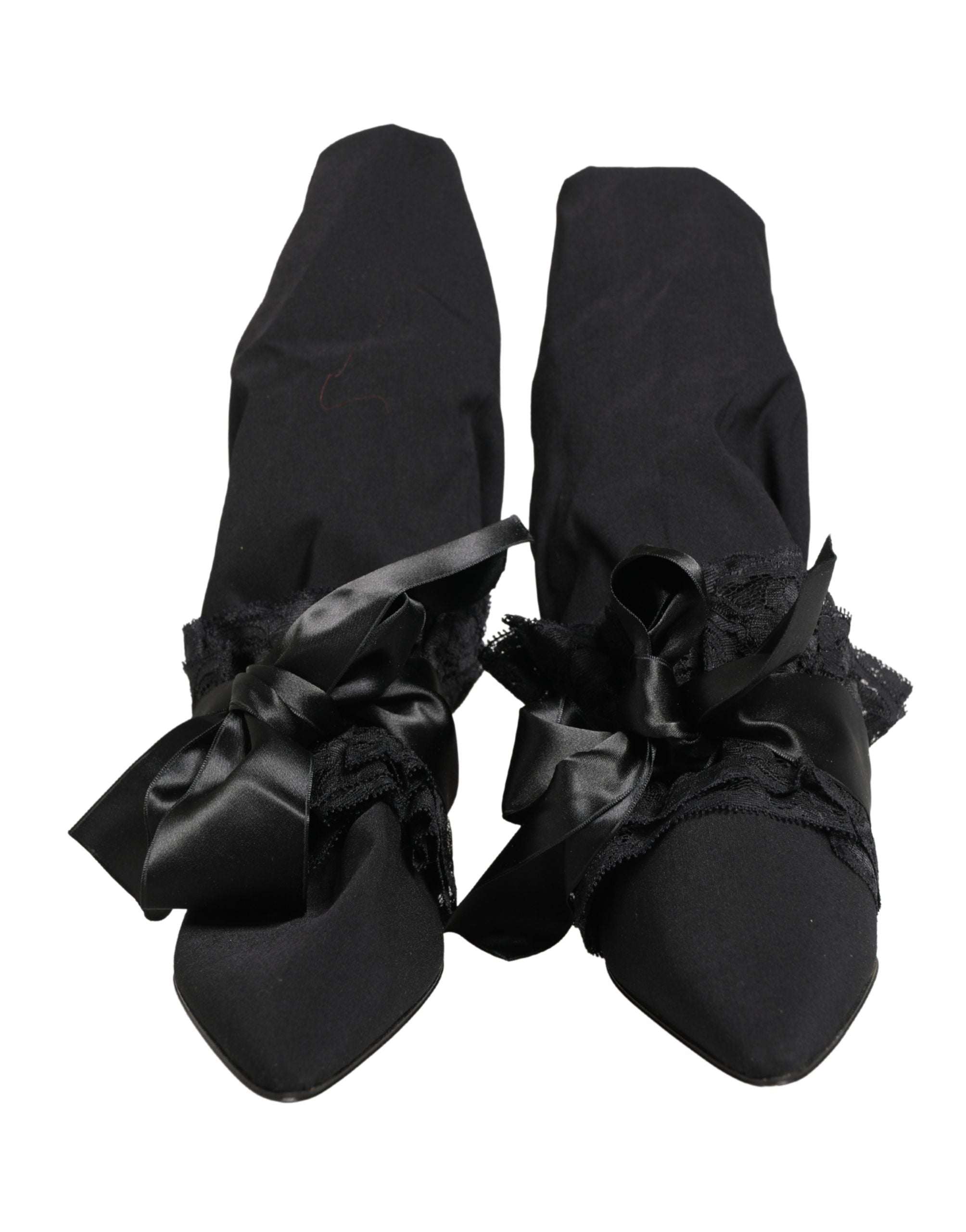 Experience the allure of Dolce & Gabbana's Black Suede Mid Calf Boots, where exquisite craftsmanship meets Italian luxury, elevating your style with timeless sophistication.