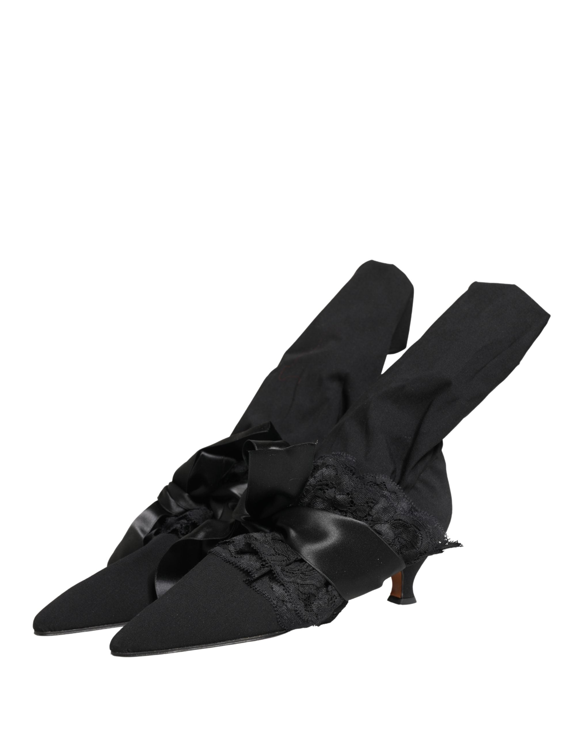 Experience the allure of Dolce & Gabbana's Black Suede Mid Calf Boots, where exquisite craftsmanship meets timeless elegance, elevating every sophisticated ensemble.