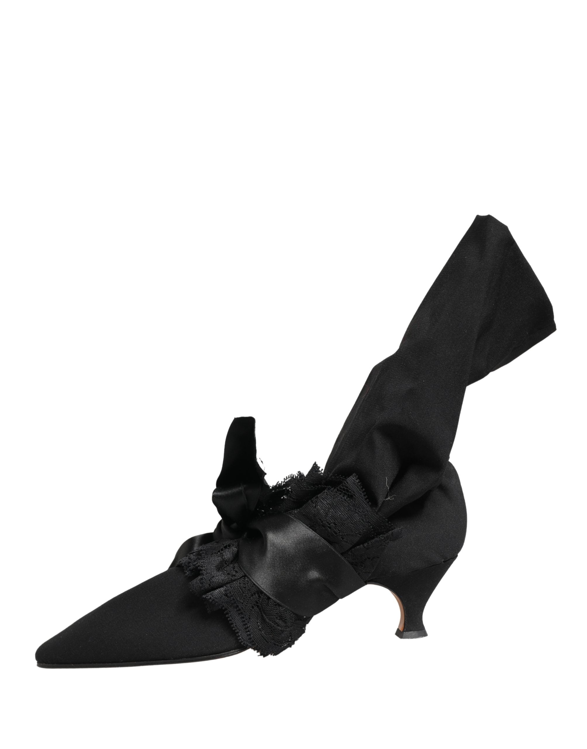 Elevate your style with Dolce & Gabbana's Black Suede Mid Calf Boots, a testament to exquisite Italian craftsmanship that embodies luxury and sophistication.