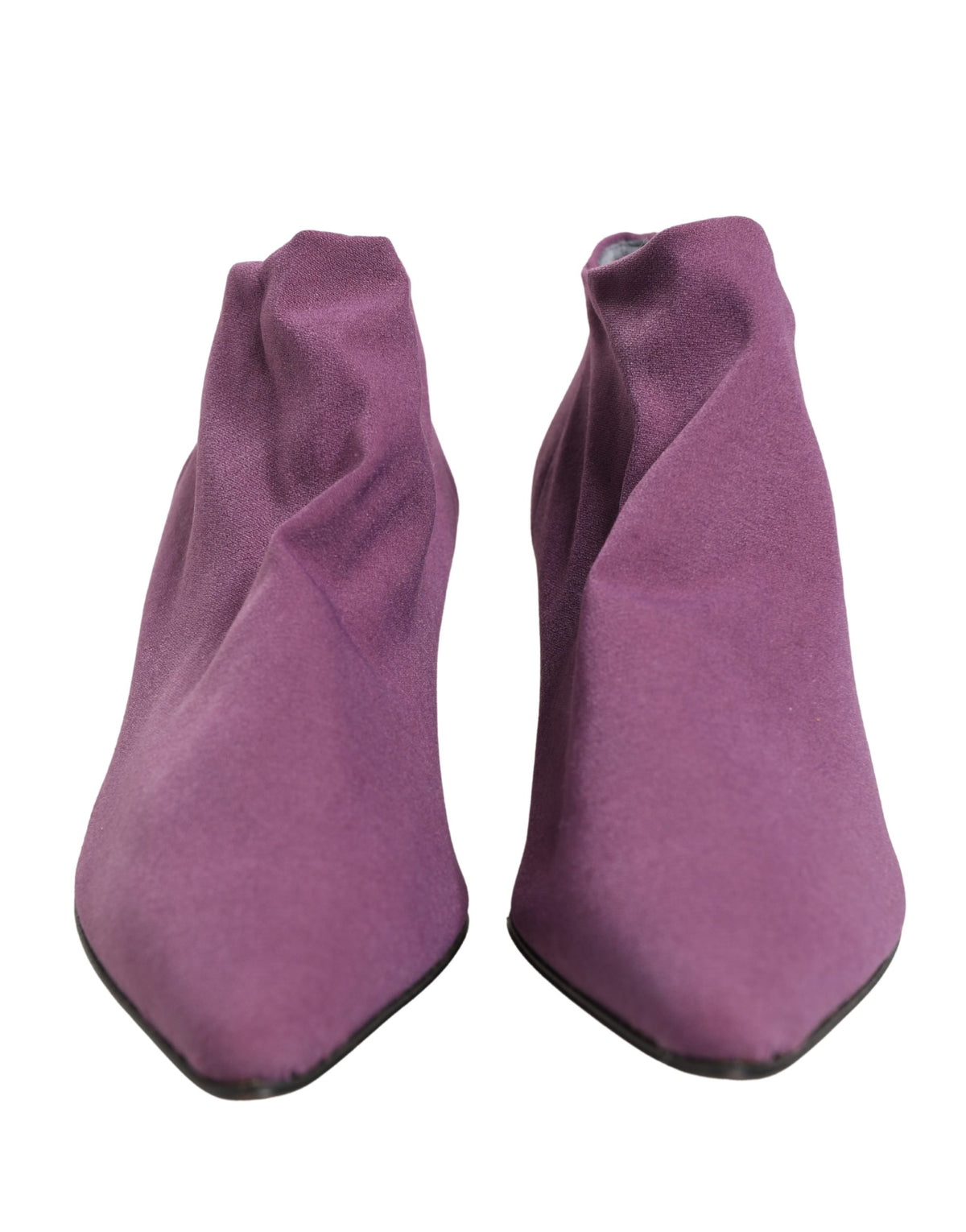 Experience the allure of Dolce & Gabbana's Purple Suede Ankle Boots, where exquisite craftsmanship meets timeless elegance, perfect for the discerning individual.