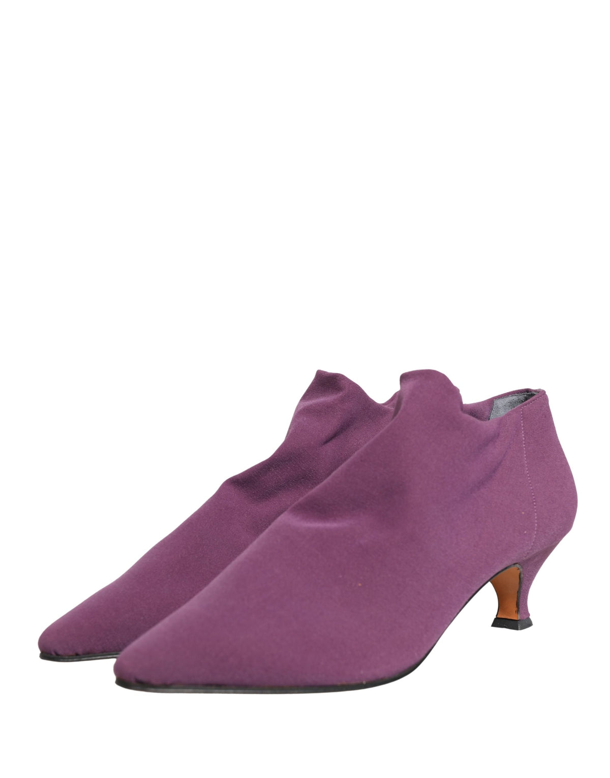Step into a realm of artisanal luxury with Dolce & Gabbana's Purple Suede Ankle Boots, where exquisite craftsmanship meets timeless elegance for the discerning individual.