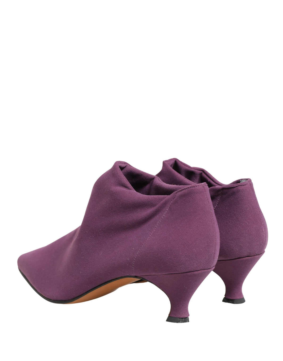Elevate your style with Dolce & Gabbana's Purple Suede Ankle Boots, a masterpiece of Italian craftsmanship that embodies luxury and sophistication for the discerning individual.