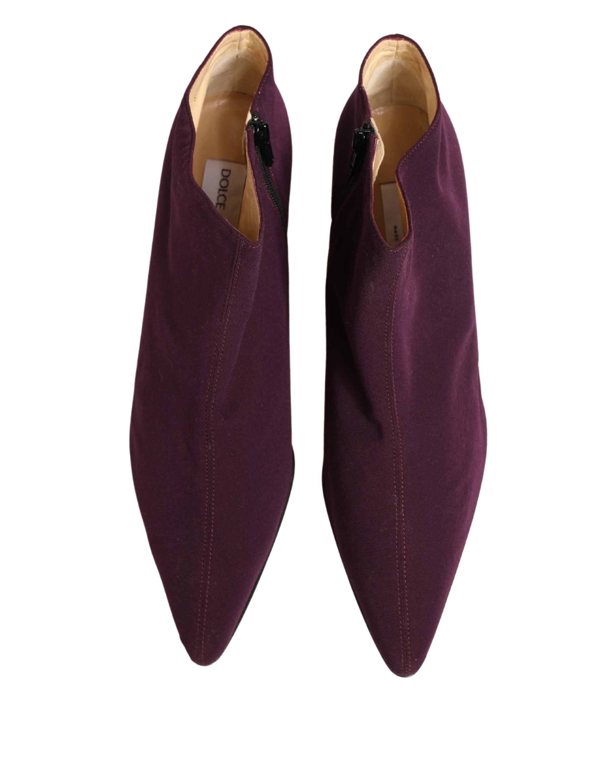 Indulge in the exquisite Dolce & Gabbana Purple Suede Ankle Boots, a testament to Italian craftsmanship that elevates your style with luxurious allure and sophistication.