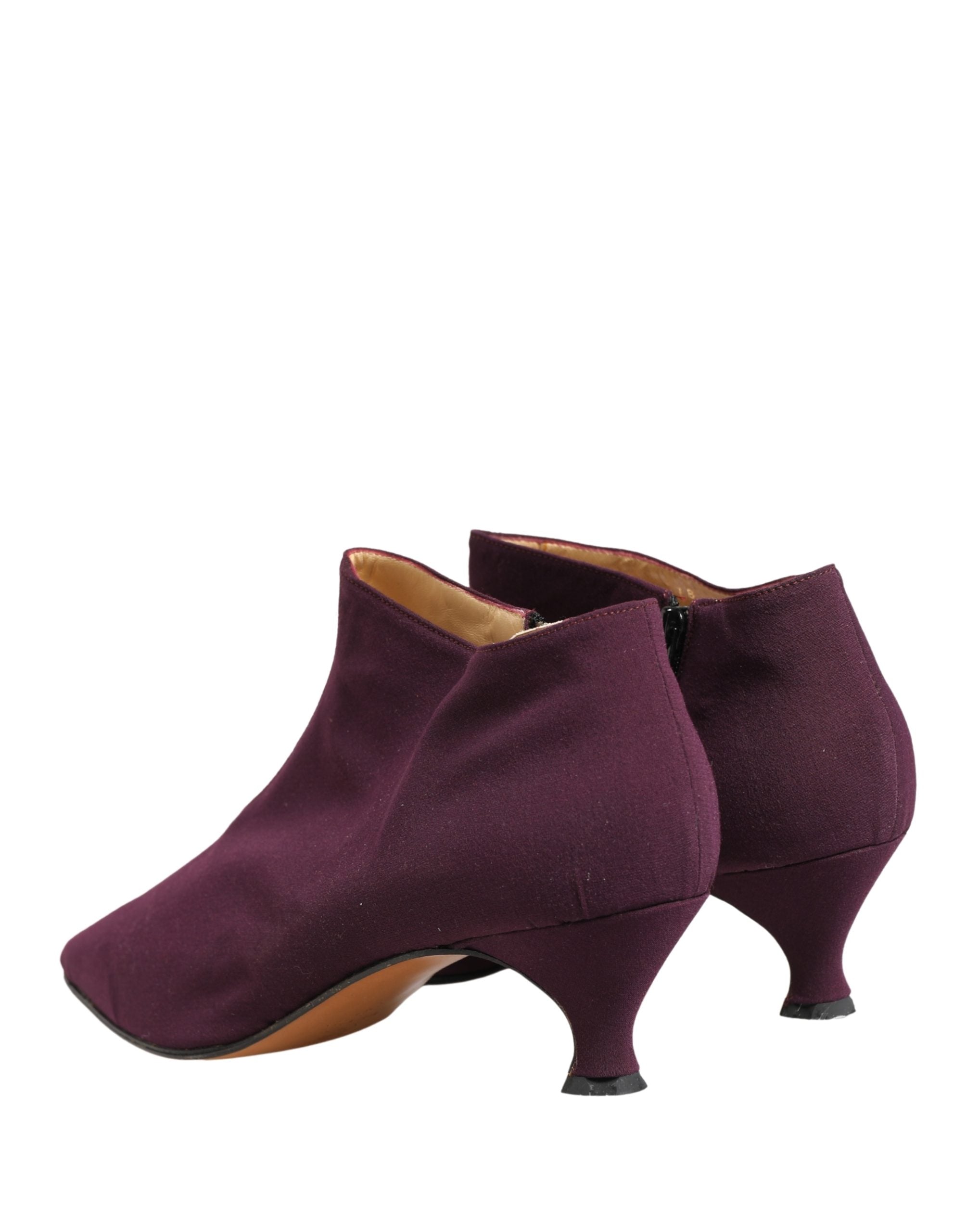 Indulge in the exquisite Dolce & Gabbana Purple Suede Ankle Boots, where luxurious craftsmanship meets bold elegance, perfect for the discerning connoisseur.