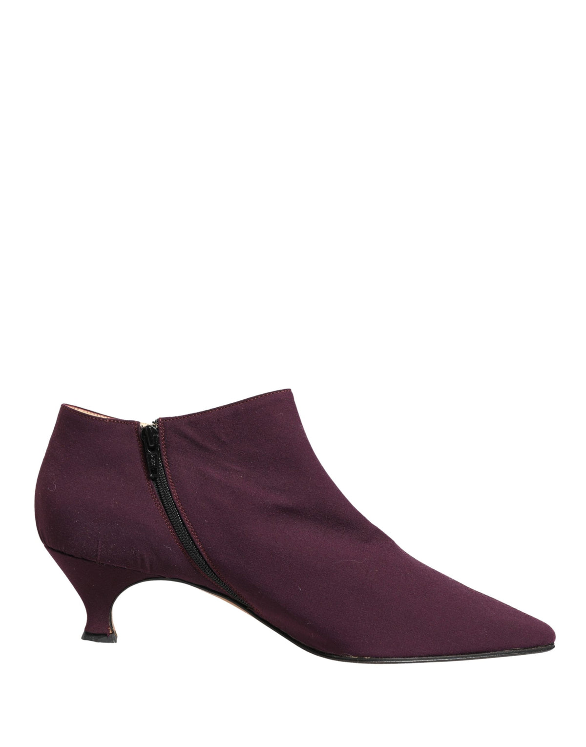 Indulge in the exquisite Dolce & Gabbana Purple Suede Ankle Boots, a testament to Italian craftsmanship that elevates your style with luxurious allure and timeless elegance.
