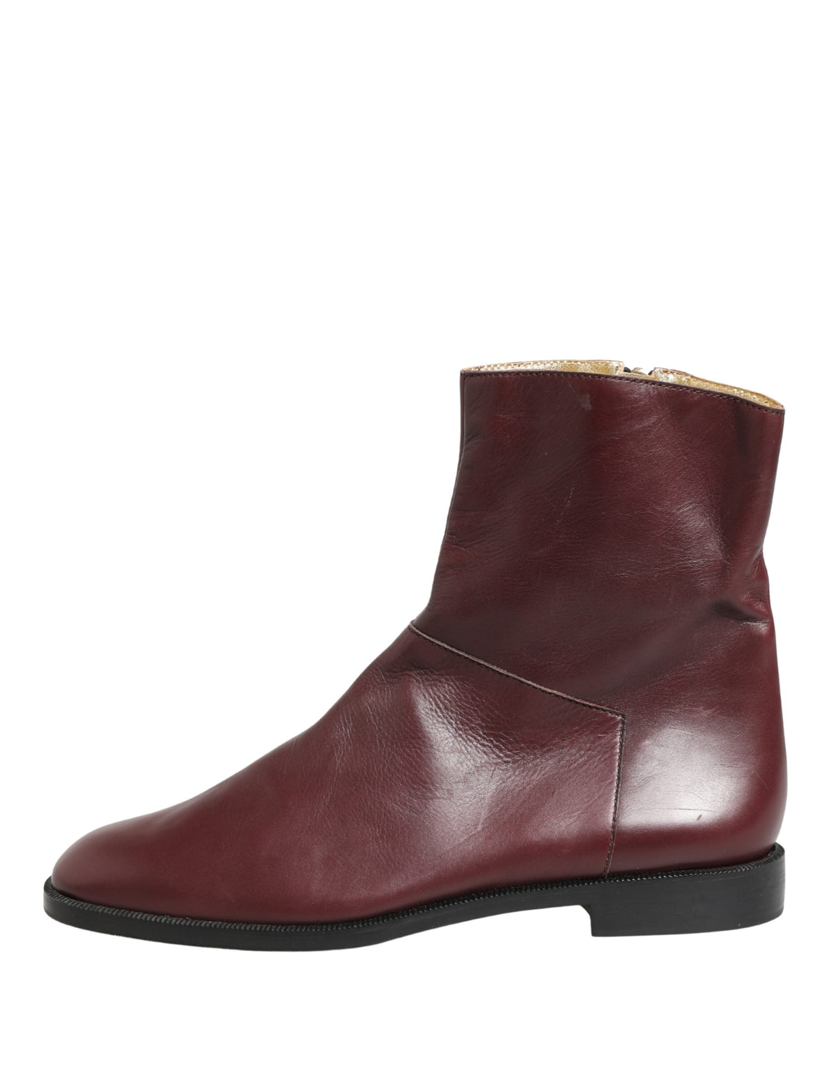 Elevate your style with Dolce & Gabbana's maroon leather ankle boots, a testament to Italian craftsmanship that embodies luxury and sophistication for every occasion.