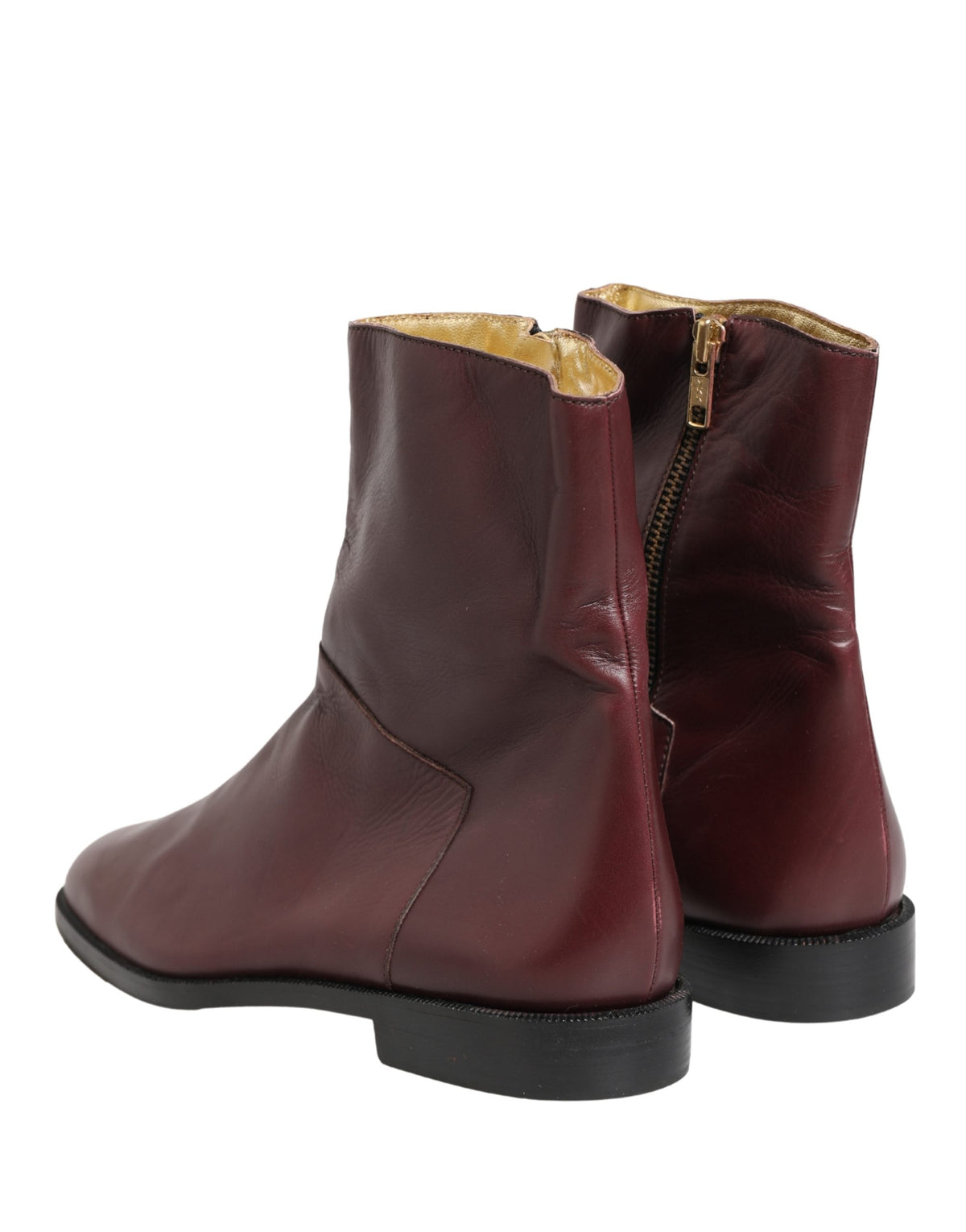 Elevate your style with Dolce & Gabbana's Maroon Leather Flats Biker Ankle Boots, a testament to Italian craftsmanship and luxury, perfect for every sophisticated affair.