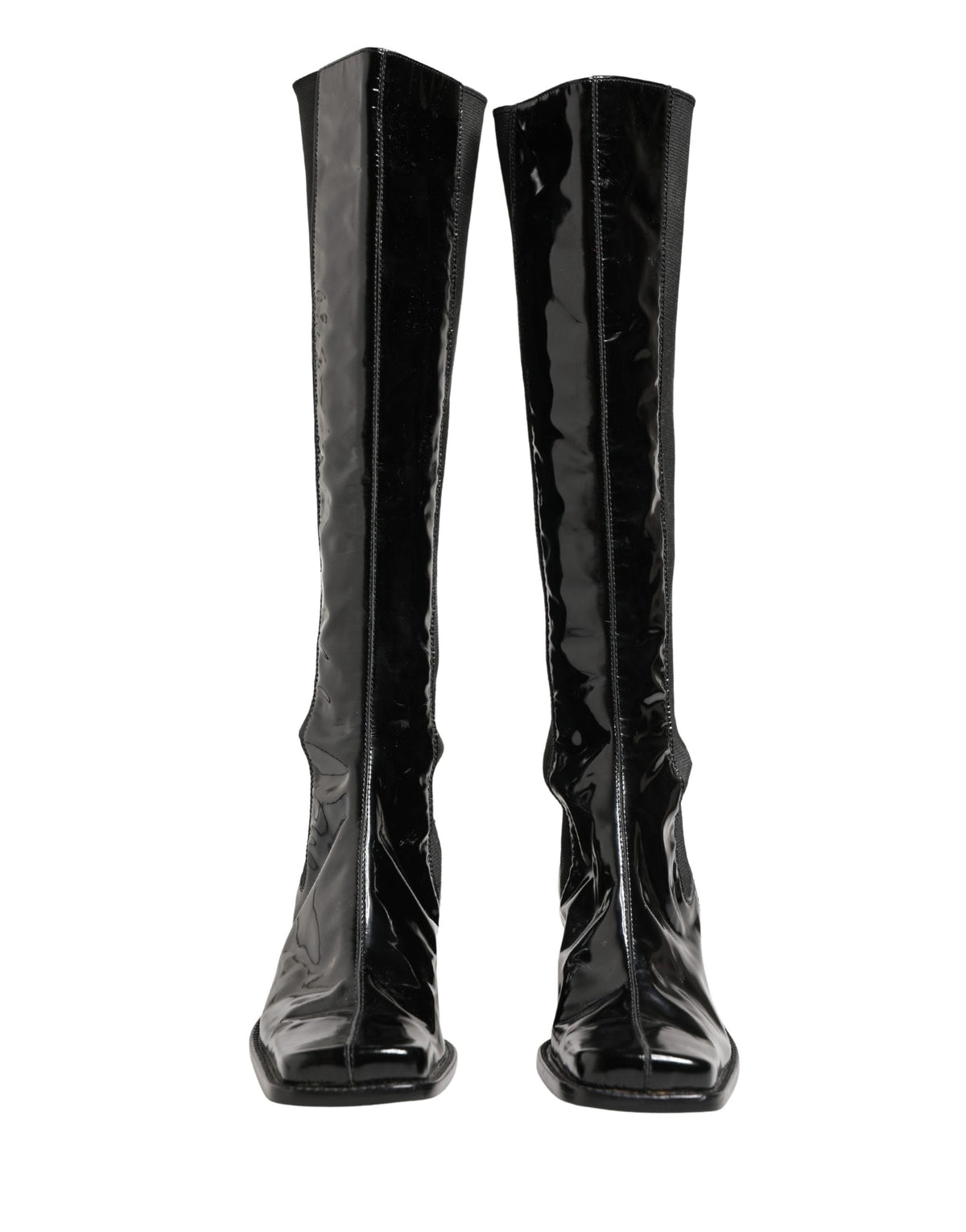 Step into the allure of Dolce & Gabbana's Black Patent Leather Knee High Boots, where exquisite Italian craftsmanship meets timeless elegance for the discerning fashionista.