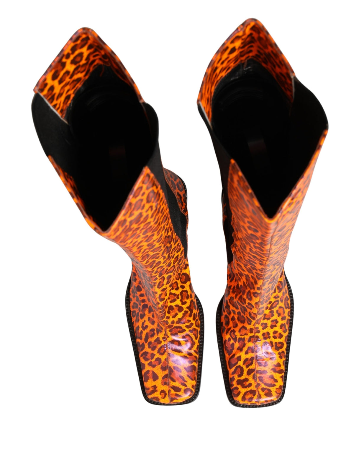 Step into the realm of luxury with Dolce & Gabbana's Brown Leopard Leather Knee High Boots, a testament to exquisite Italian craftsmanship and timeless elegance.