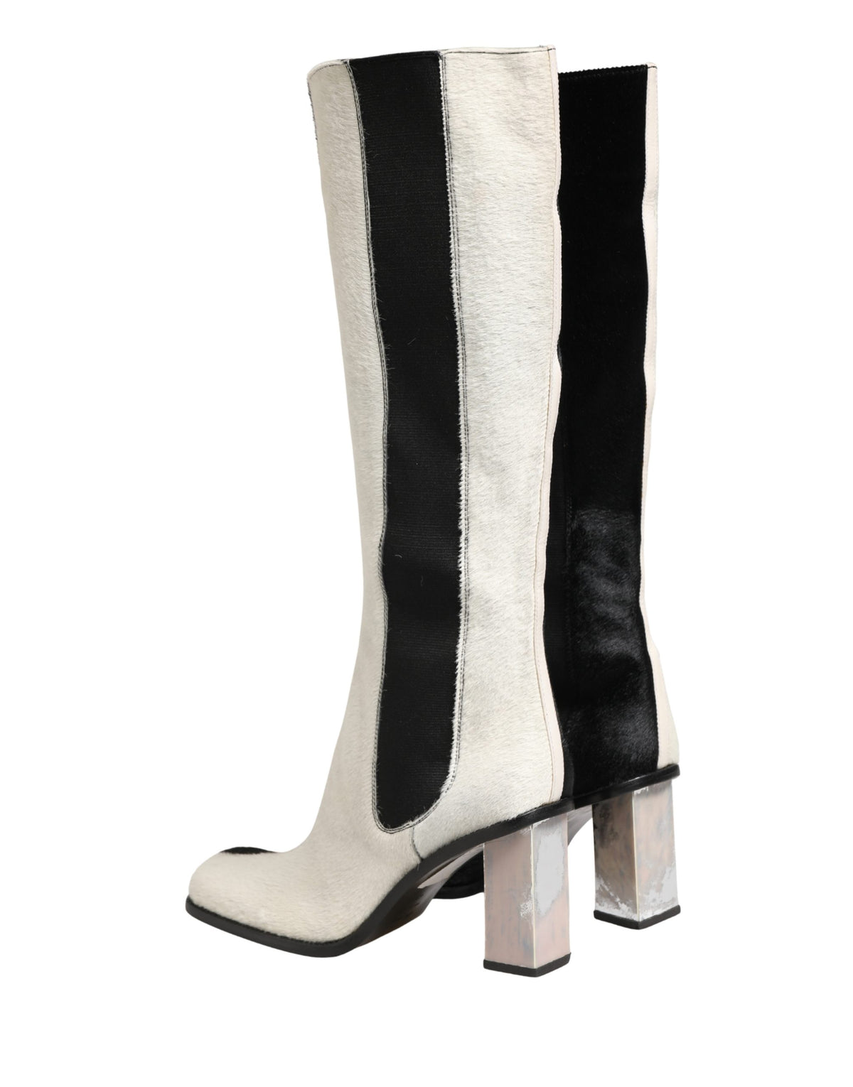 Step into the realm of luxury with Dolce & Gabbana's exquisite knee-high boots, where Italian craftsmanship meets timeless elegance, perfect for the discerning individual.