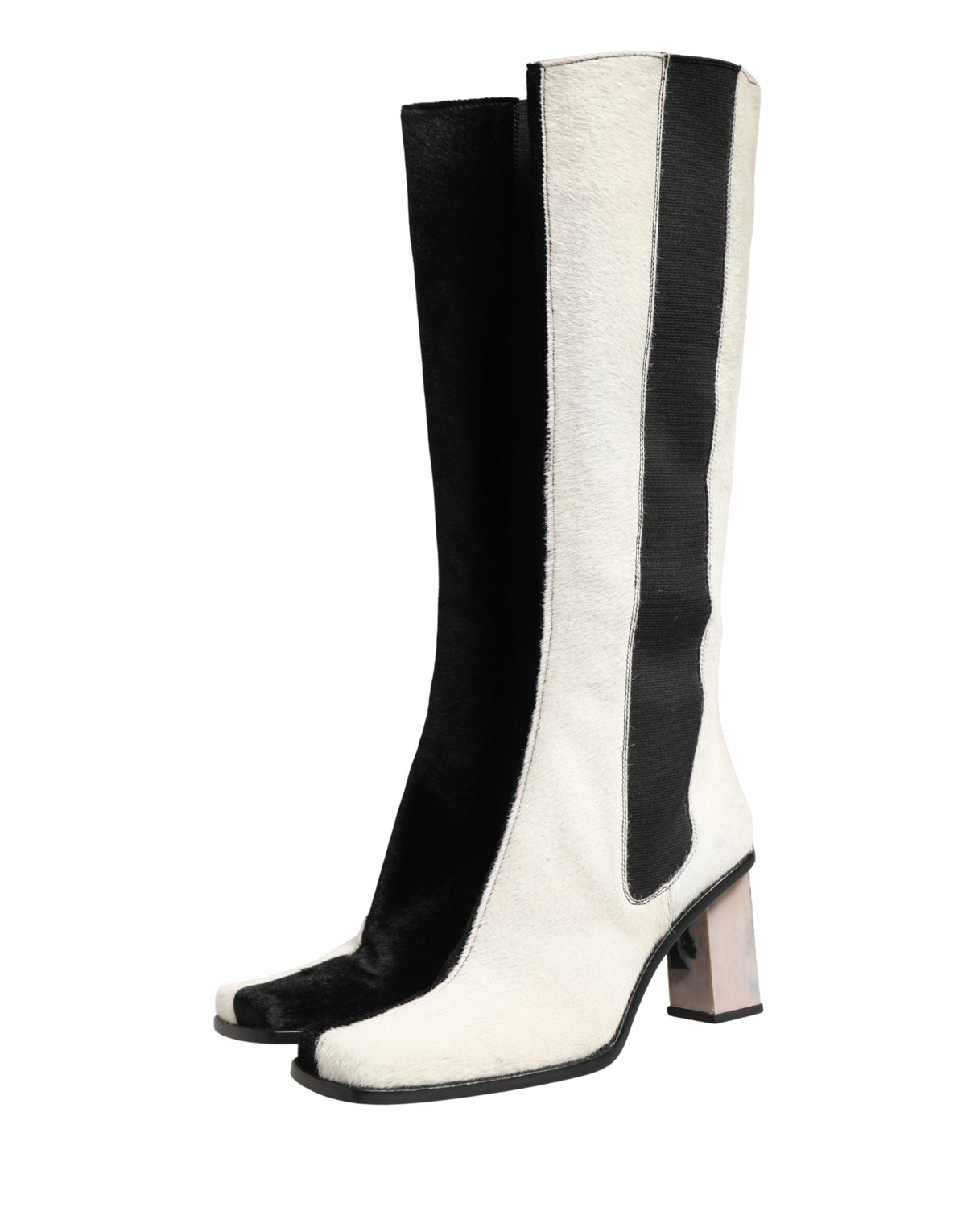 Step into the realm of elegance with Dolce & Gabbana's knee-high leather boots, where exquisite craftsmanship meets timeless allure, perfect for any sophisticated occasion.
