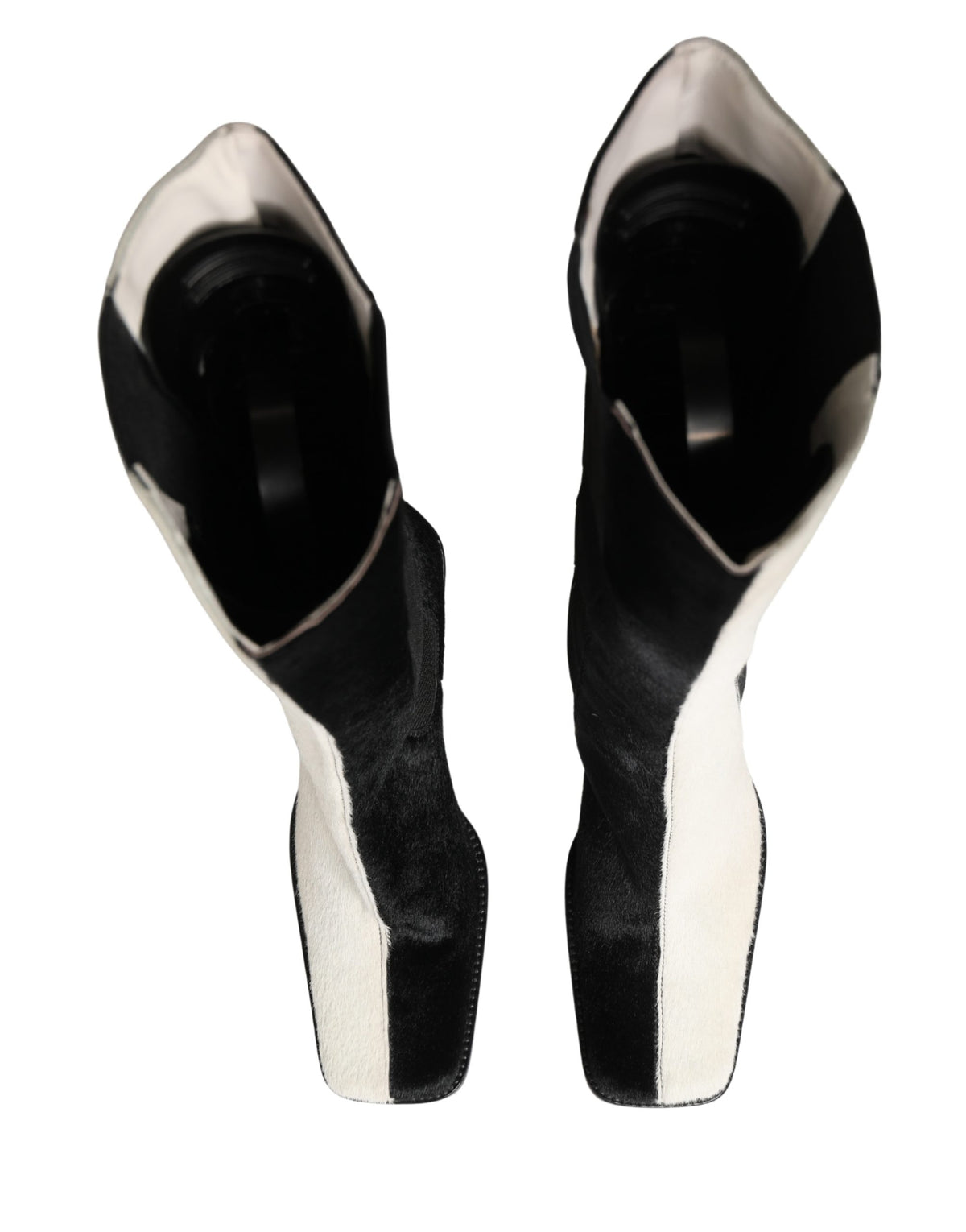Step into a world of elegance with Dolce & Gabbana's knee-high leather boots, where Italian craftsmanship meets timeless luxury, perfect for every sophisticated occasion.