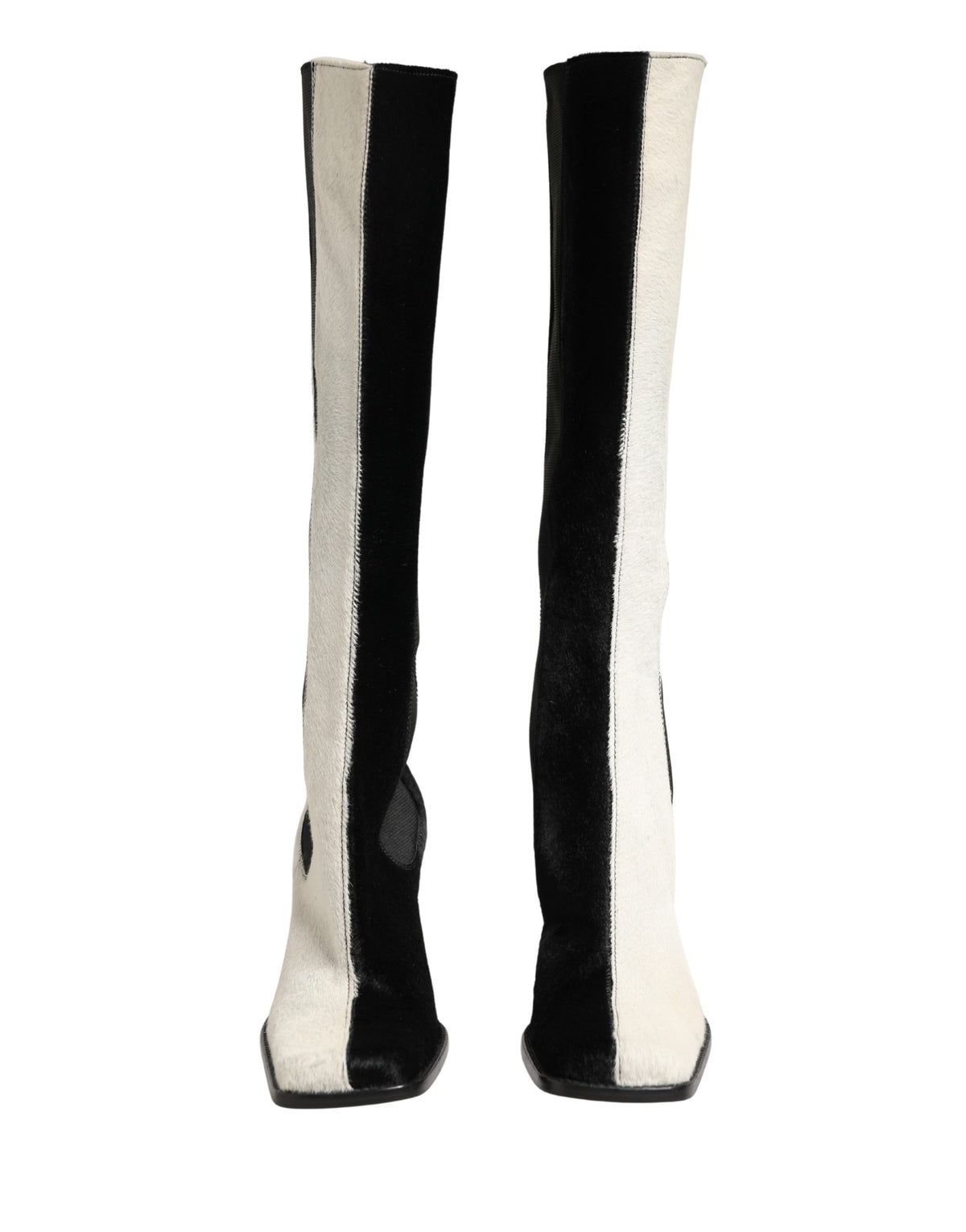 Step into the realm of luxury with Dolce & Gabbana's exquisite knee-high boots, where Italian craftsmanship meets timeless elegance for the discerning individual.