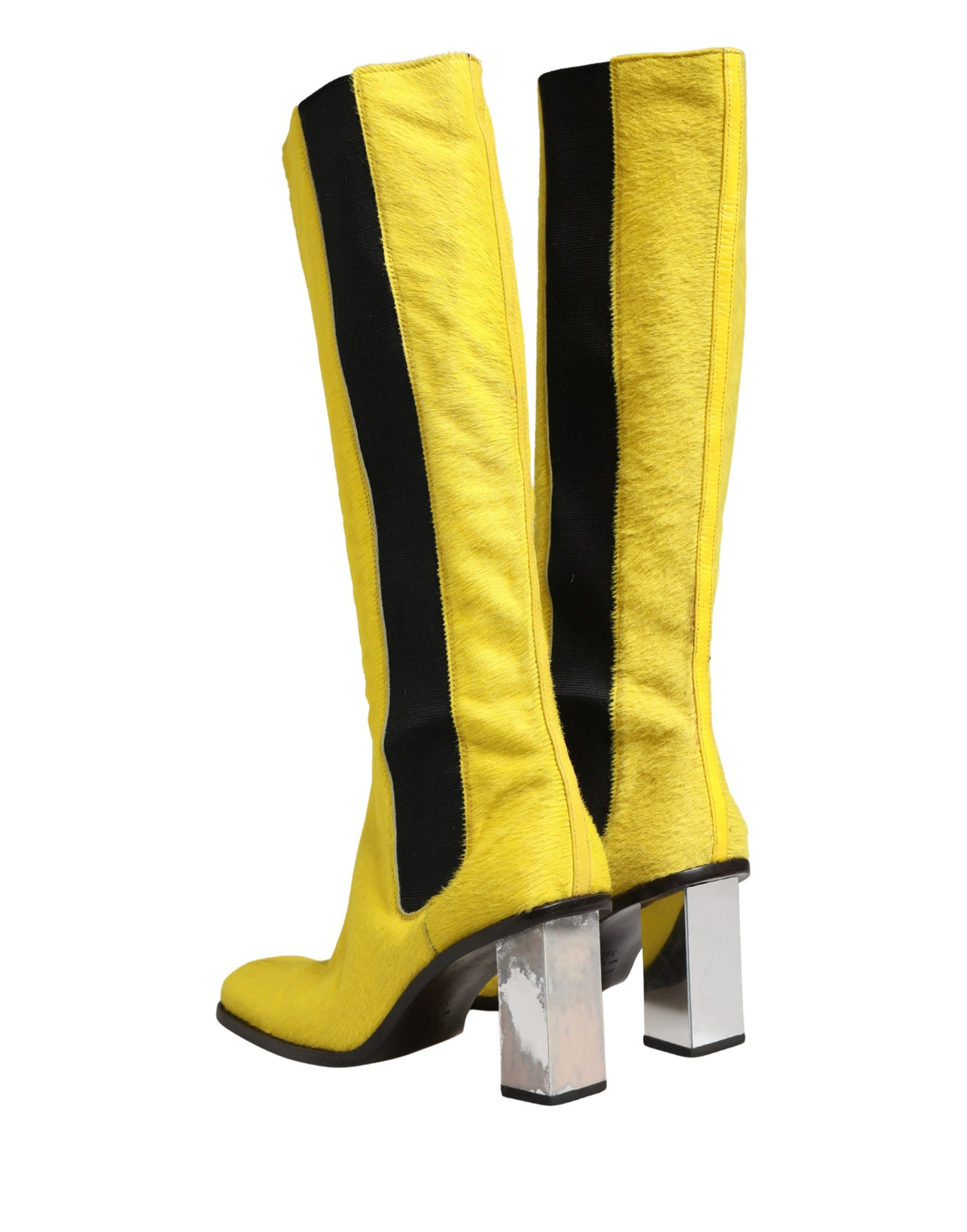 Step into the realm of luxury with Dolce & Gabbana's exquisite knee-high boots, where Italian craftsmanship meets bold elegance, perfect for the discerning fashion aficionado.