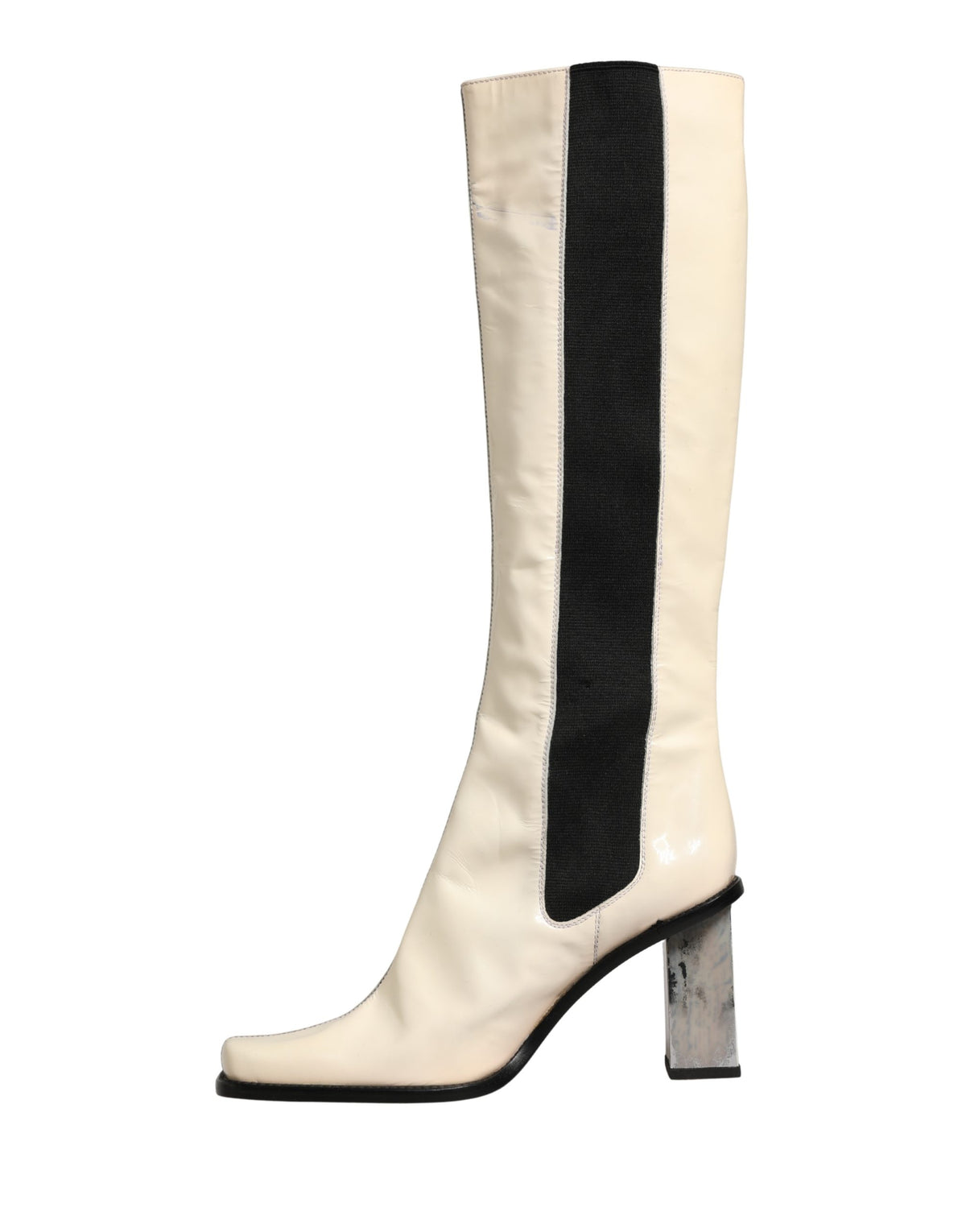 Step into a realm of elegance with Dolce & Gabbana's knee-high leather boots, where exquisite craftsmanship meets timeless sophistication for the discerning individual.