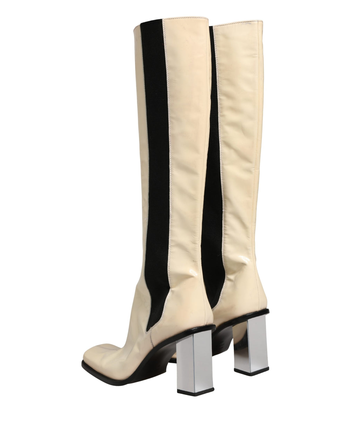 Step into elegance with Dolce & Gabbana's knee-high boots, where exquisite leather meets Italian craftsmanship, embodying timeless luxury for the discerning individual.