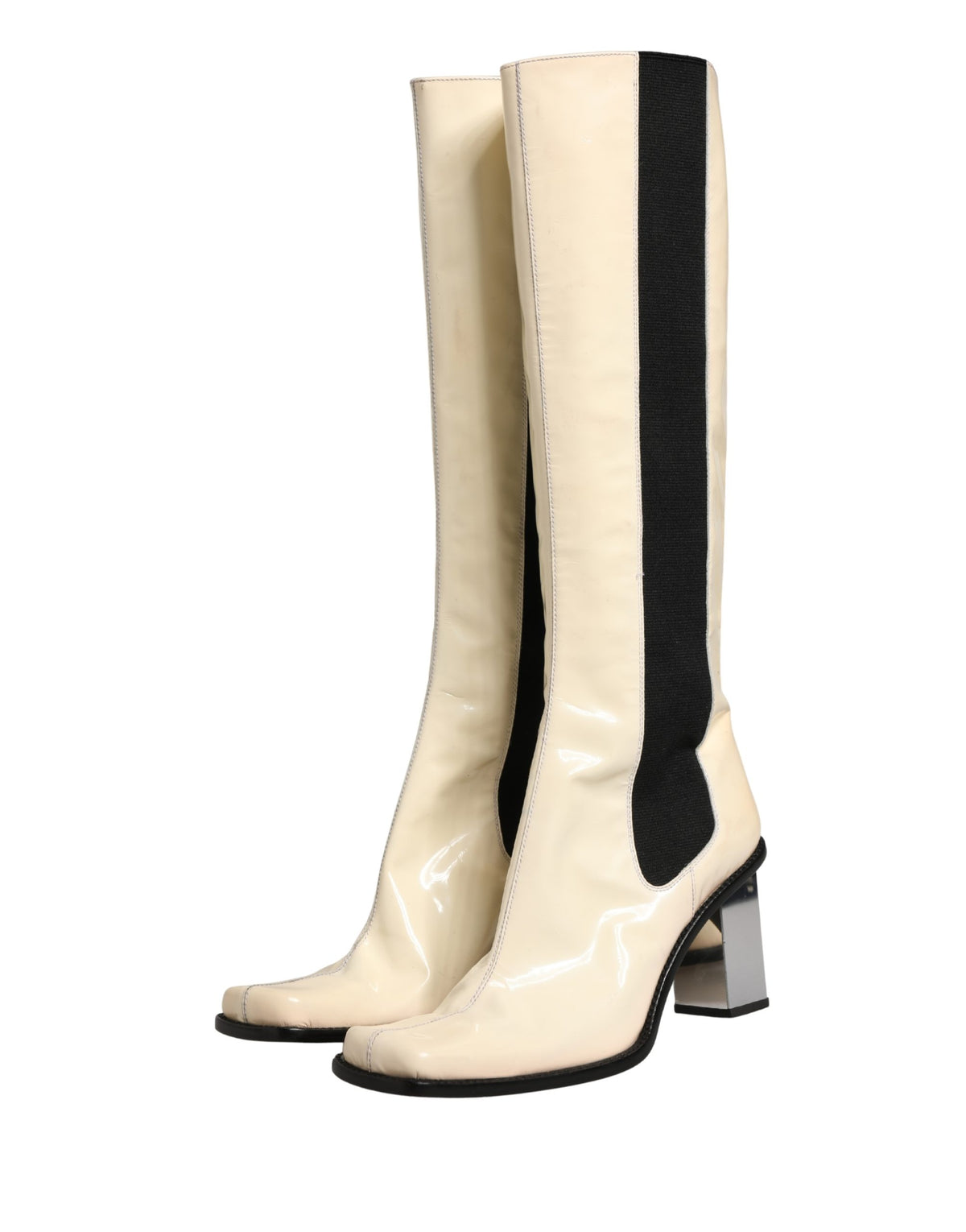 Experience the allure of Dolce & Gabbana's White Black Leather Knee High Boots, where exquisite craftsmanship meets timeless elegance, perfect for the discerning fashion connoisseur.