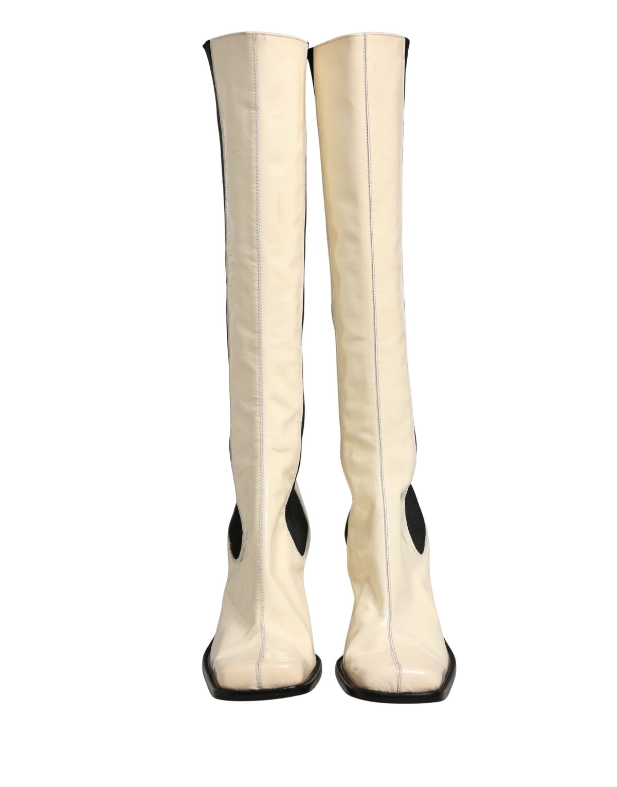 Elevate your style with Dolce & Gabbana's exquisite knee-high boots, crafted from luxurious leather, embodying timeless elegance and Italian artistry for the discerning fashion connoisseur.