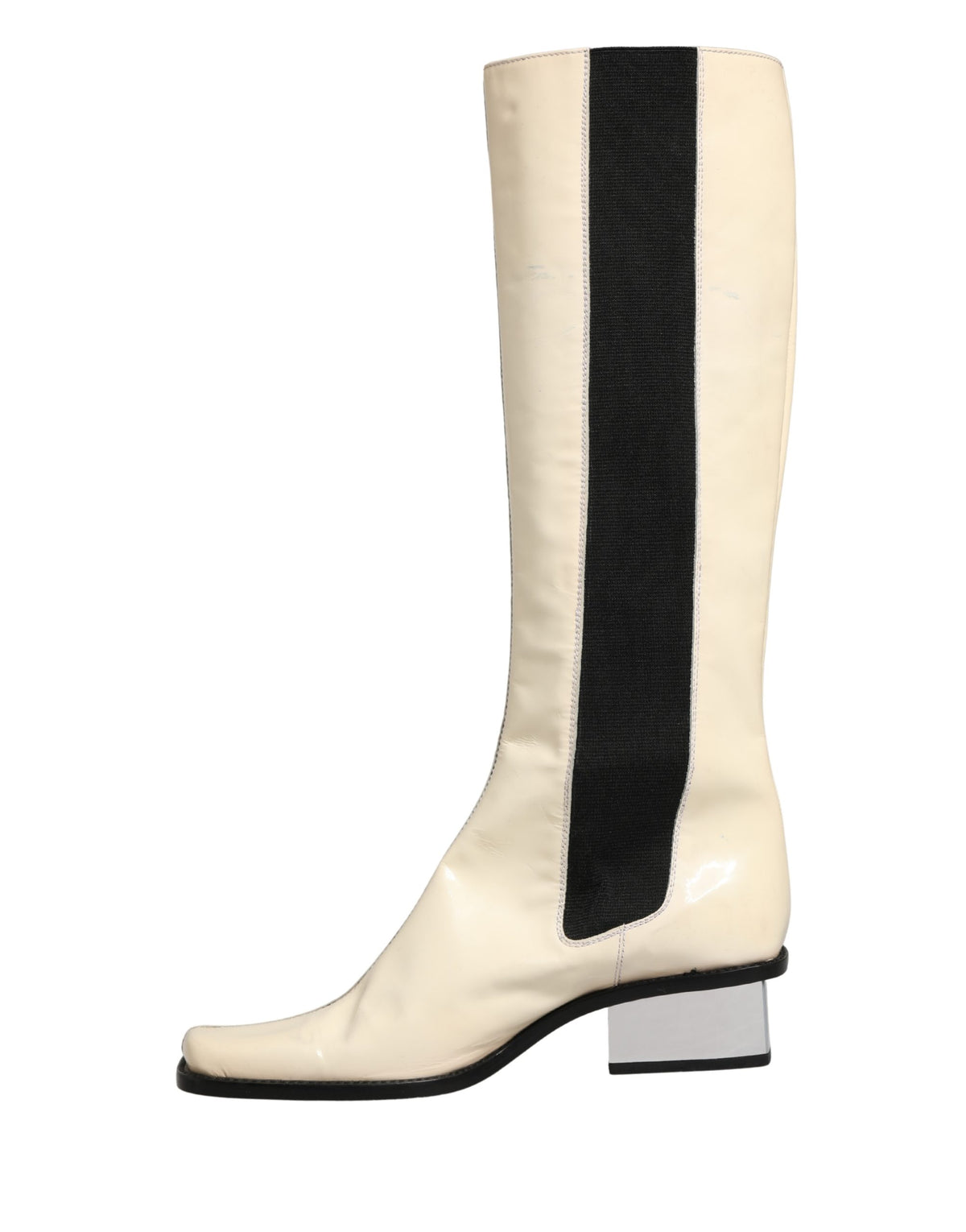 Indulge in the elegance of Dolce & Gabbana knee-high boots, crafted from luxurious leather, merging timeless sophistication with Italian artistry for the discerning connoisseur.