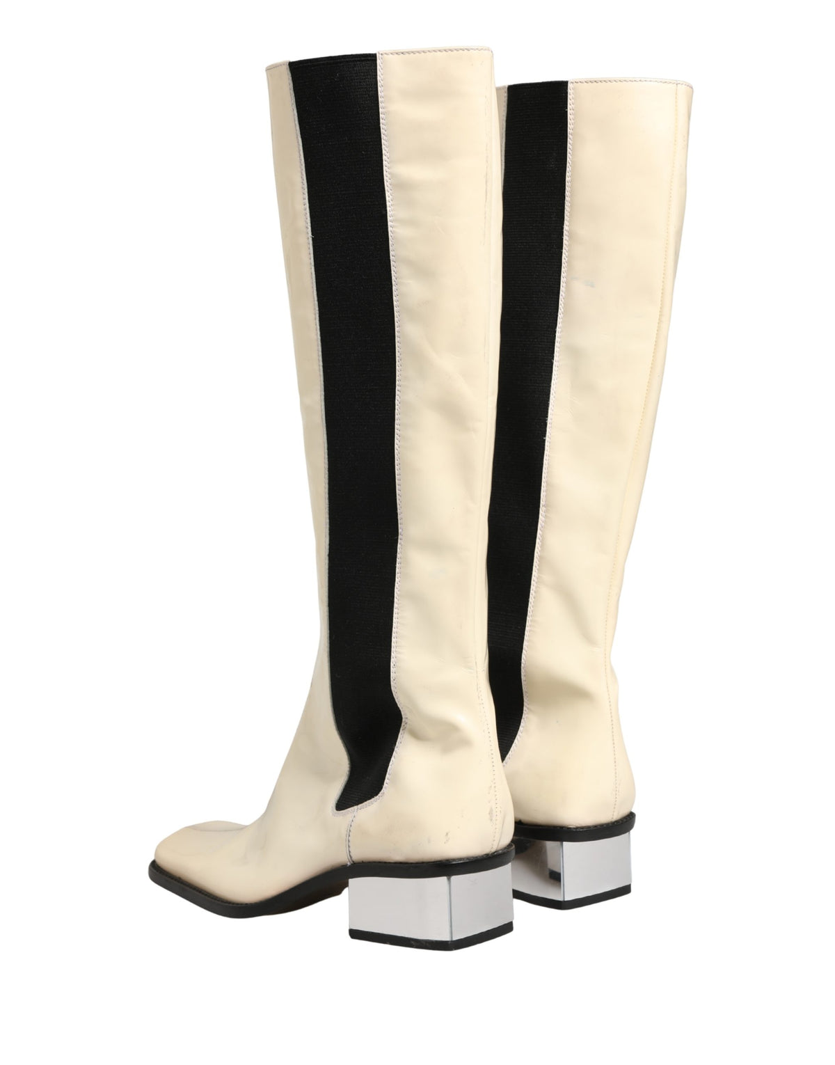 Elevate your style with Dolce & Gabbana's exquisite knee-high boots, a fusion of luxurious leather and Italian craftsmanship, perfect for any sophisticated occasion.