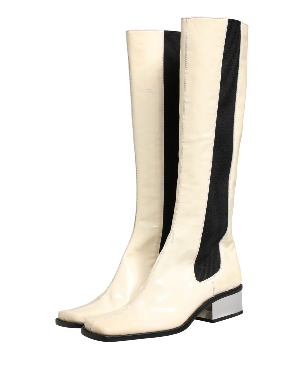 Elevate your style with Dolce & Gabbana's exquisite knee-high boots, a fusion of luxurious leather and Italian craftsmanship, perfect for the discerning connoisseur.