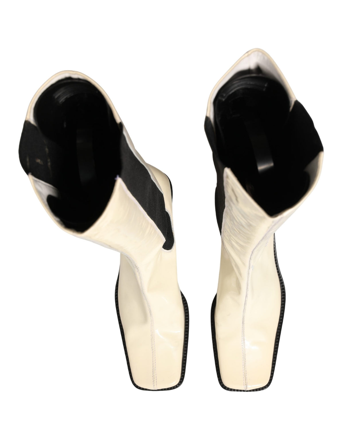 Elevate your style with Dolce & Gabbana's exquisite knee-high boots, a fusion of Italian craftsmanship and timeless elegance, perfect for the discerning connoisseur.