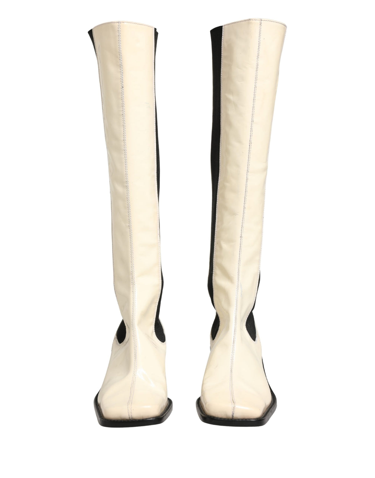 Elevate your style with Dolce & Gabbana's luxurious knee-high boots, crafted from exquisite leather, embodying timeless elegance and Italian craftsmanship for the discerning connoisseur.