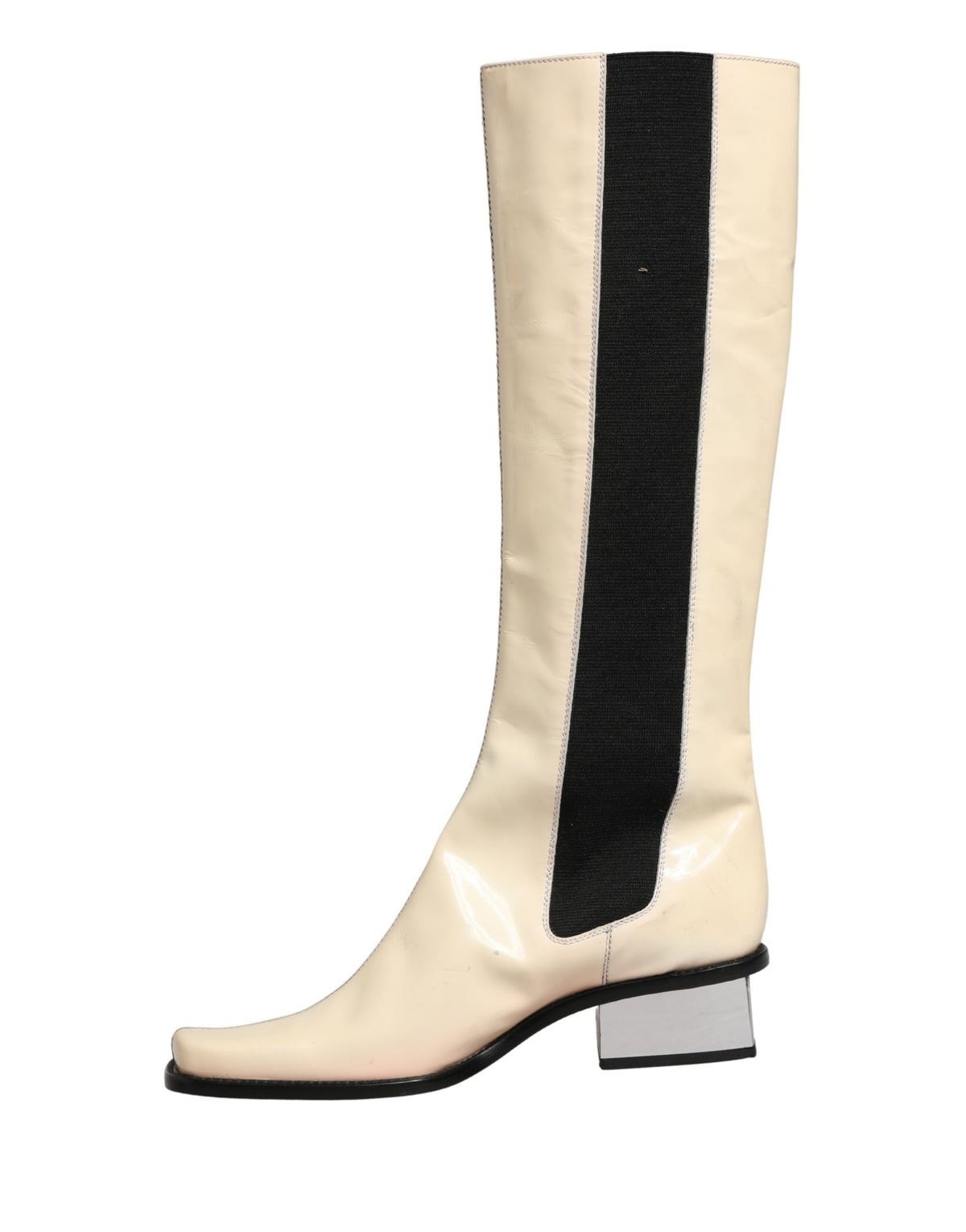 Elevate your wardrobe with Dolce & Gabbana's exquisite knee-high boots, where luxurious leather meets artisanal craftsmanship for an unparalleled statement of style.