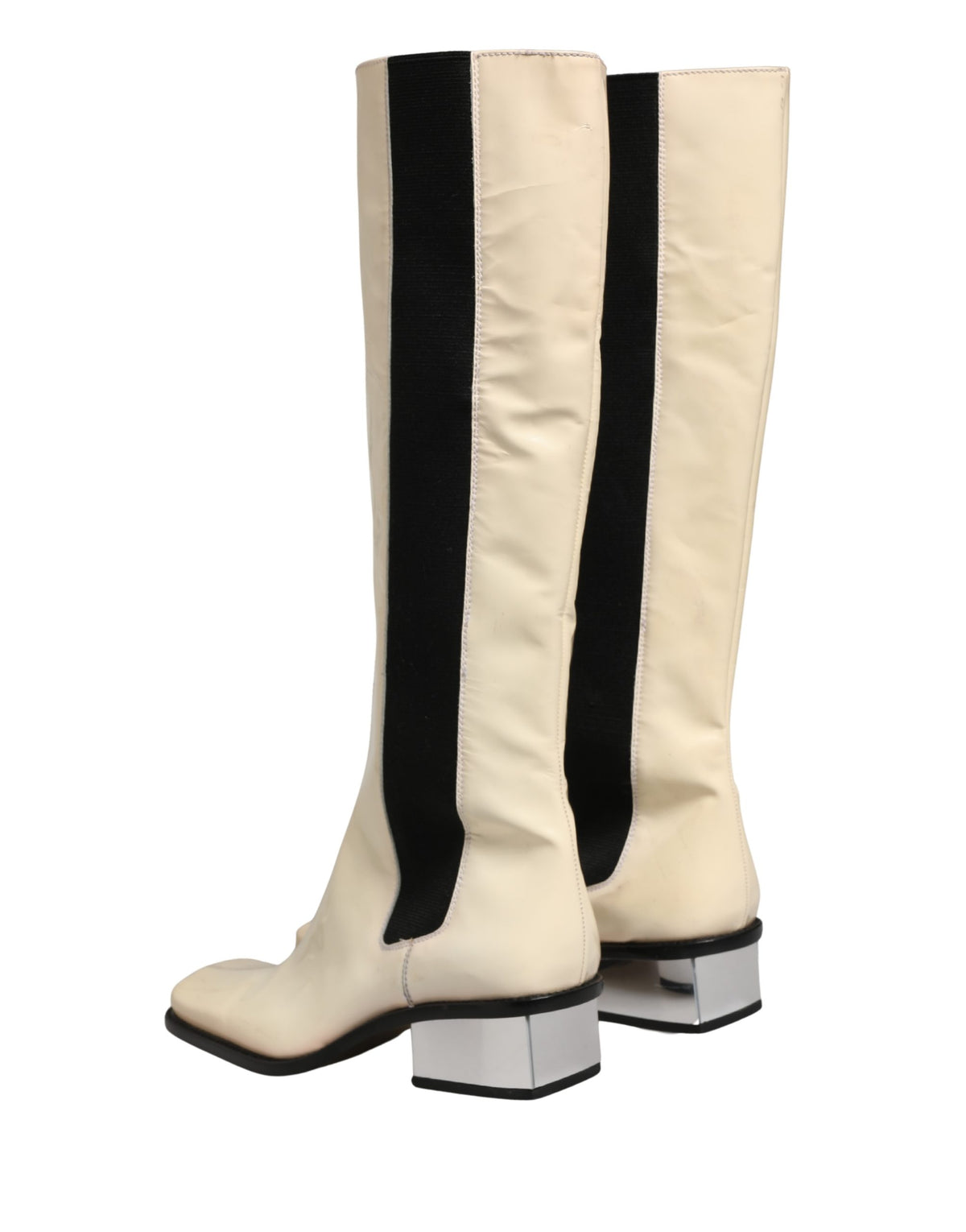 Experience the exquisite allure of Dolce & Gabbana's knee-high boots, where luxurious leather meets artisanal craftsmanship, embodying timeless elegance for the discerning individual.