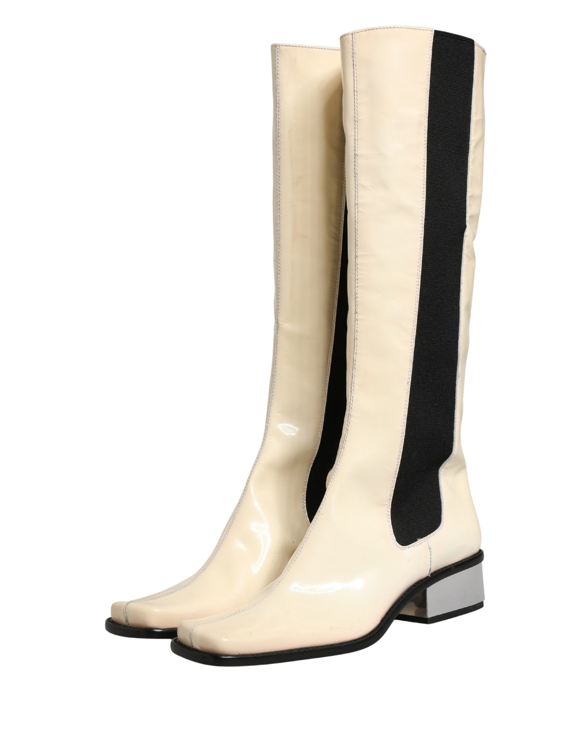 Elevate your style with Dolce & Gabbana's exquisite knee-high boots, where luxurious leather meets artisanal craftsmanship for a statement of timeless elegance.
