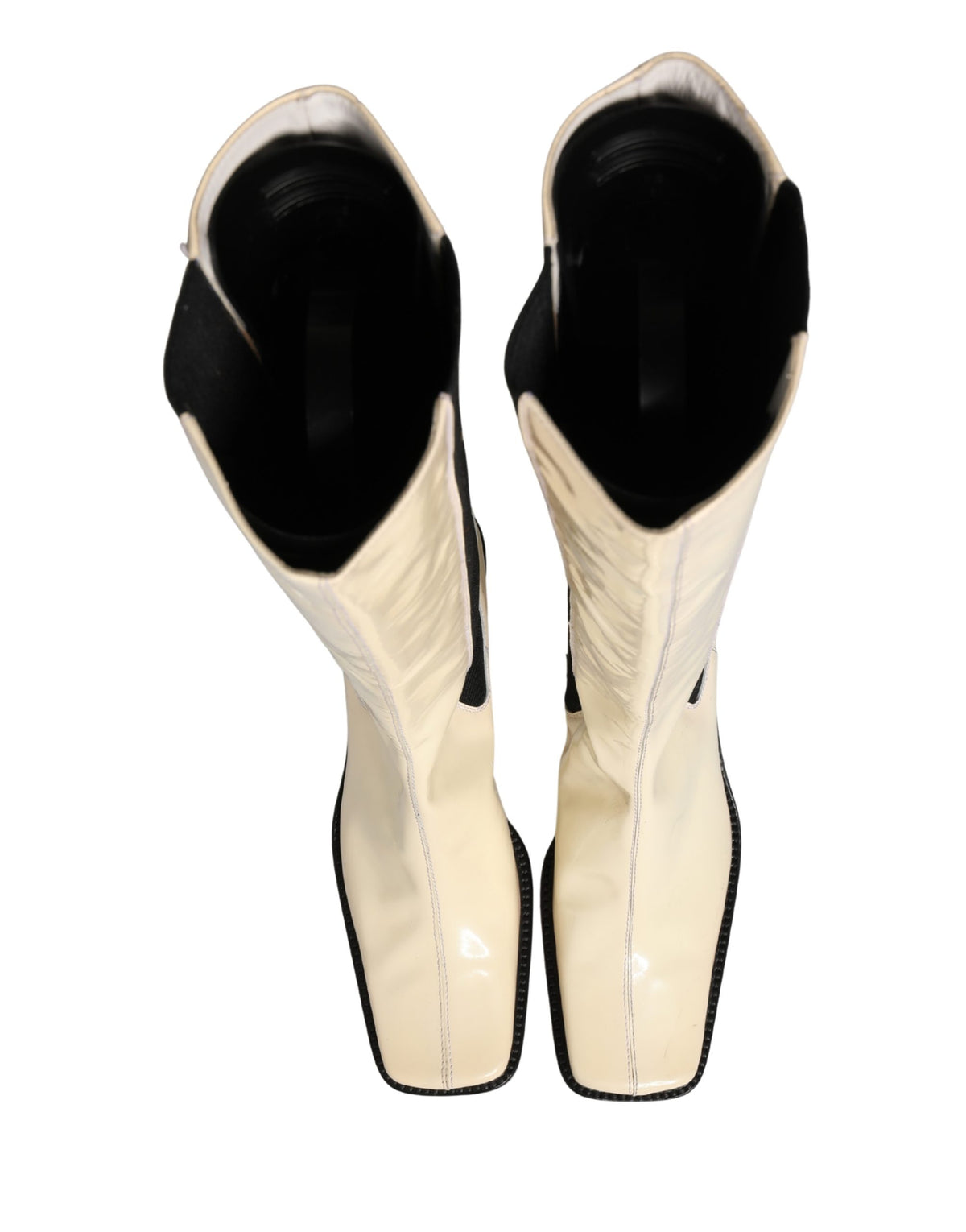 Elevate your style with Dolce & Gabbana's exquisite knee-high boots, where luxurious leather meets timeless elegance, perfect for the discerning fashion connoisseur.