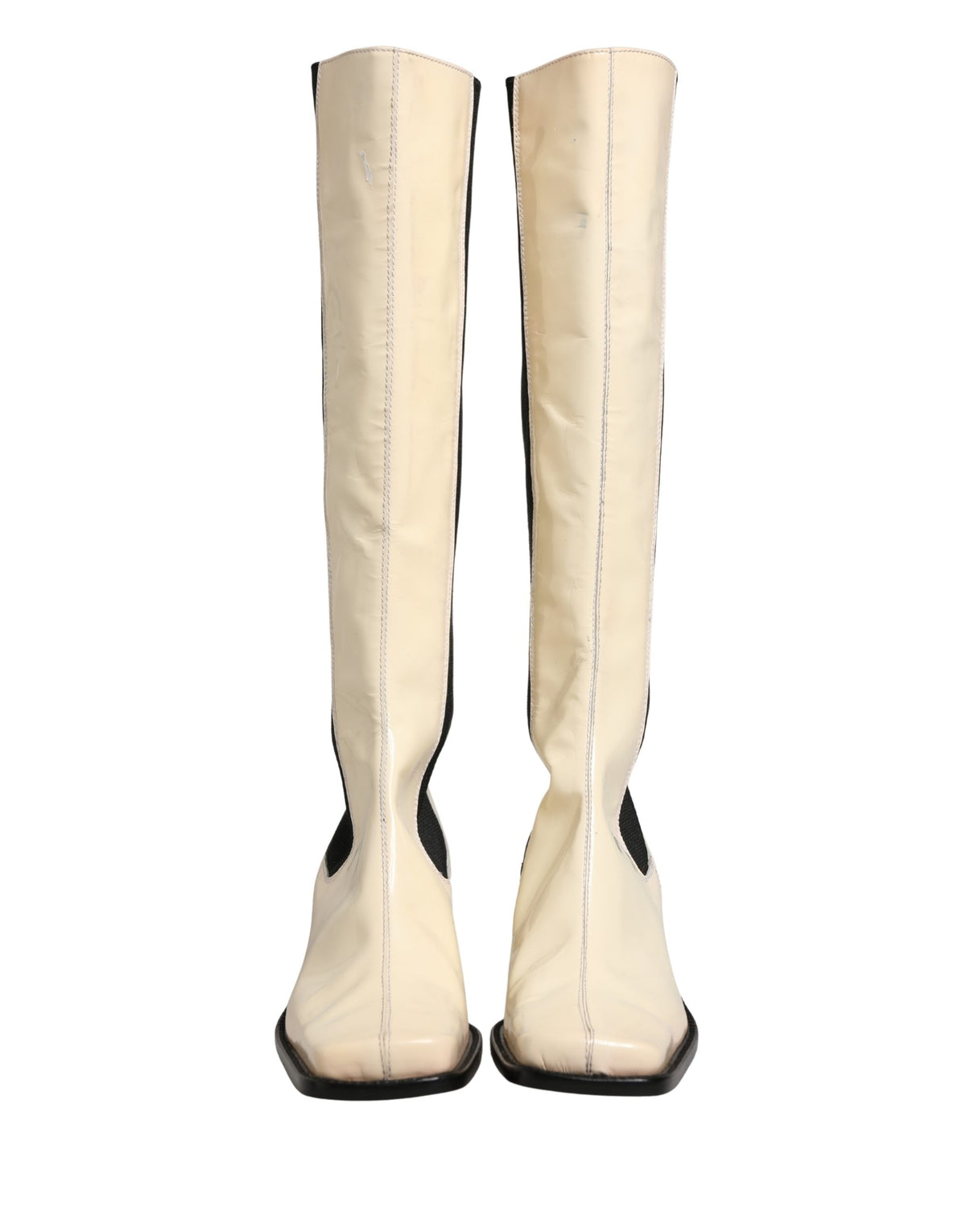 Elevate your style with Dolce & Gabbana's exquisite knee-high boots, crafted from luxurious leather, embodying timeless elegance and artisanal sophistication.