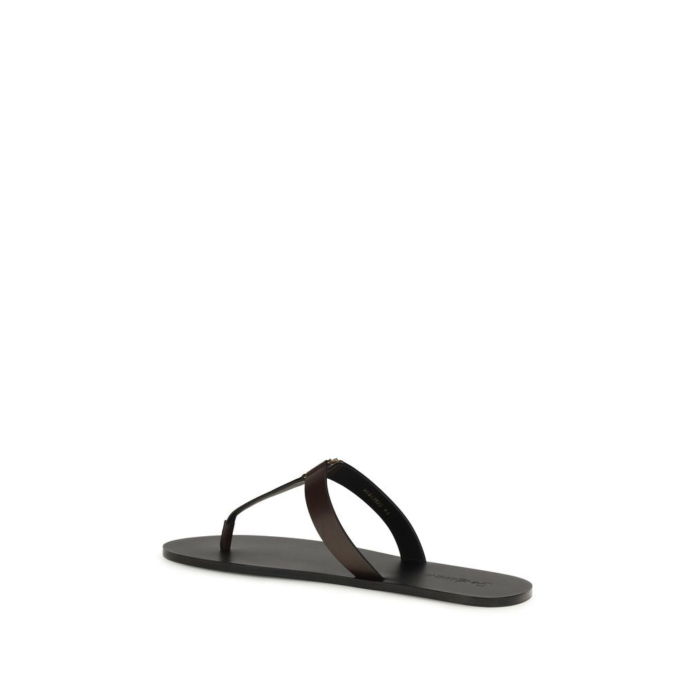 Indulge in the elegance of Saint Laurent's Brown Calf Leather Bos Taurus Flat Sandals, where minimalist design meets luxurious craftsmanship for effortless summer sophistication.